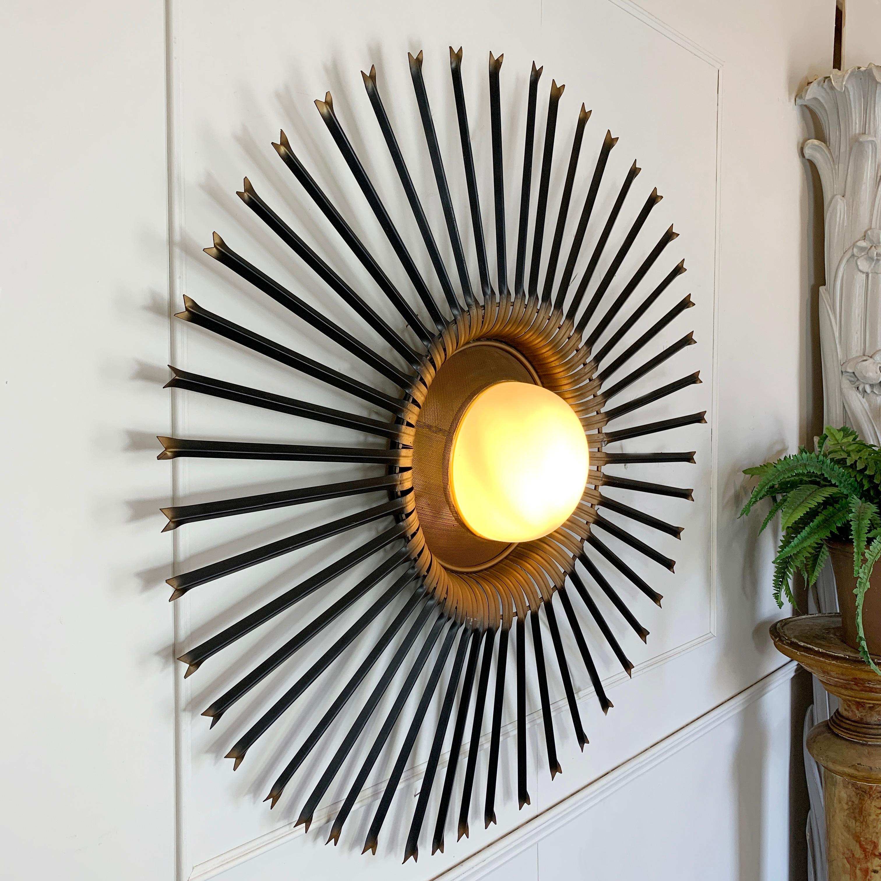 An exceptional and extremely rare wall light from Chaty Vallauris. Of monumental proportions, Chaty are renowned for their mirrors which are highly prized and sought after interior design pieces. This light is extremely rare, and the only example we