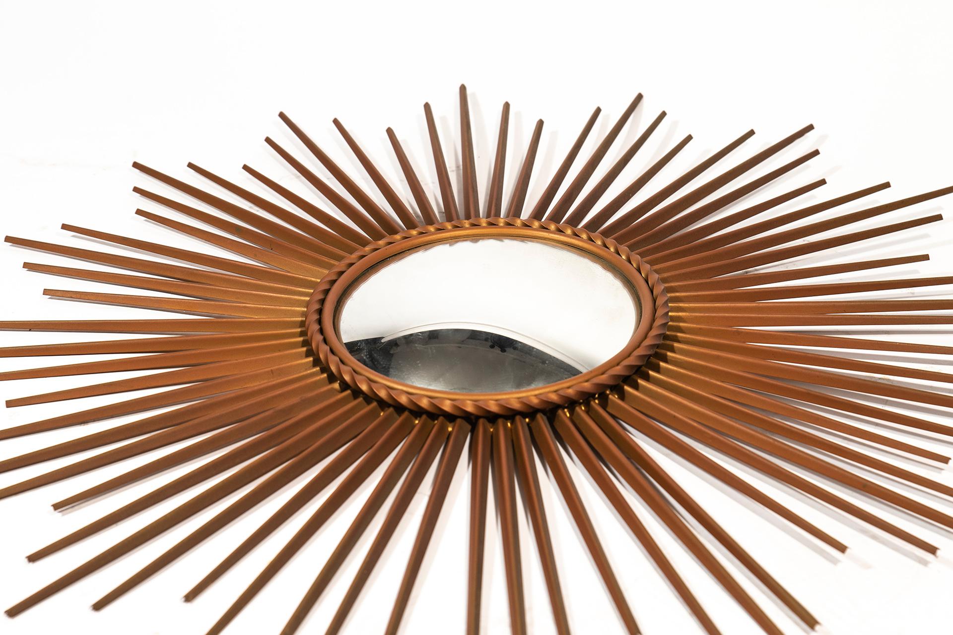 Chaty Vallauris, wall mirror,
metal gilted, signed,
circa 1970, France.
Measure: Height 71 cm, diameter 71 cm.