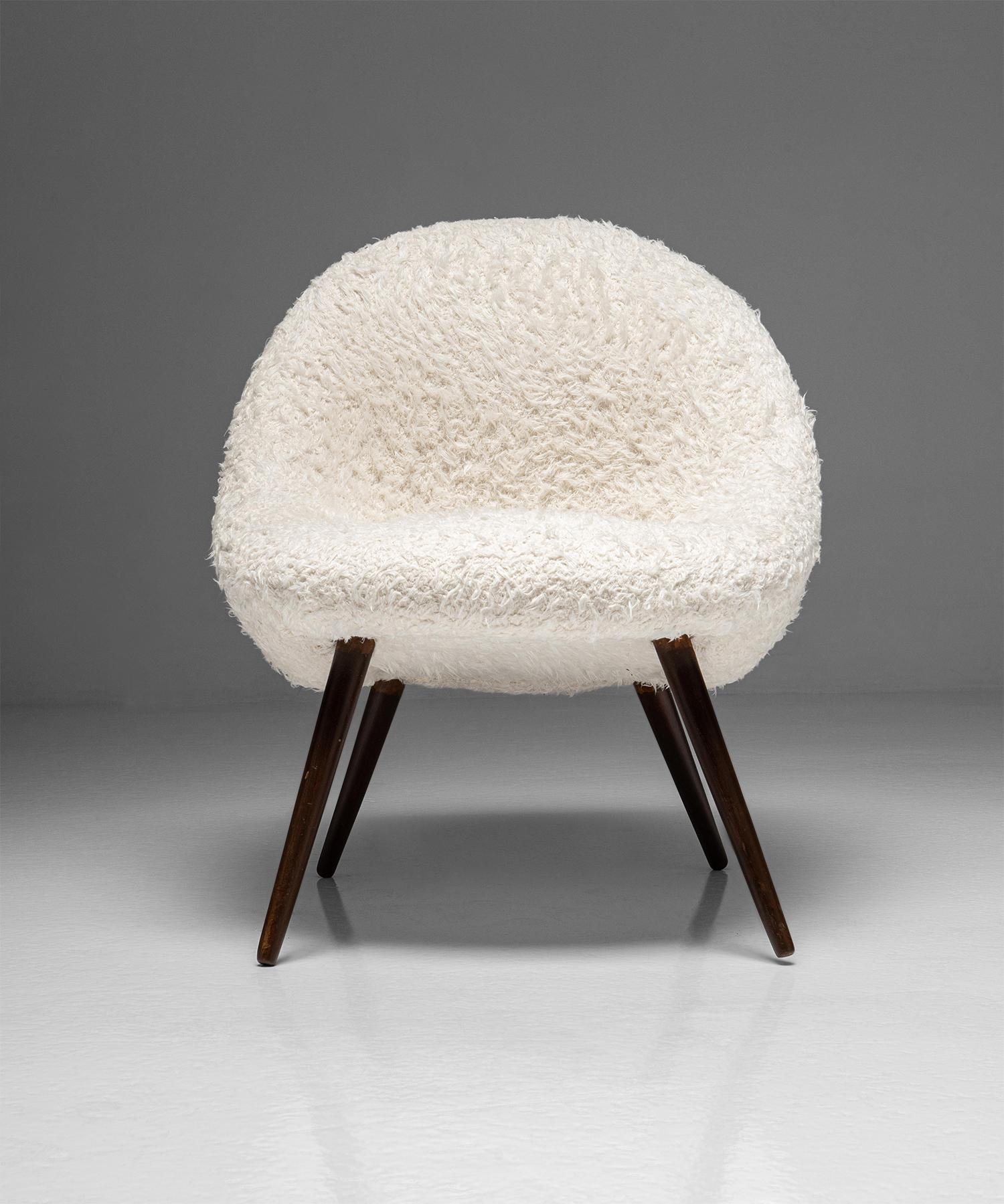 France Circa 1960

Newly upholstered in faux sheepskin, with curved “egg” shape on splayed and tapered legs.

Measures: 24”W x 17”D x 28.5”H w/ 17.5” seat.