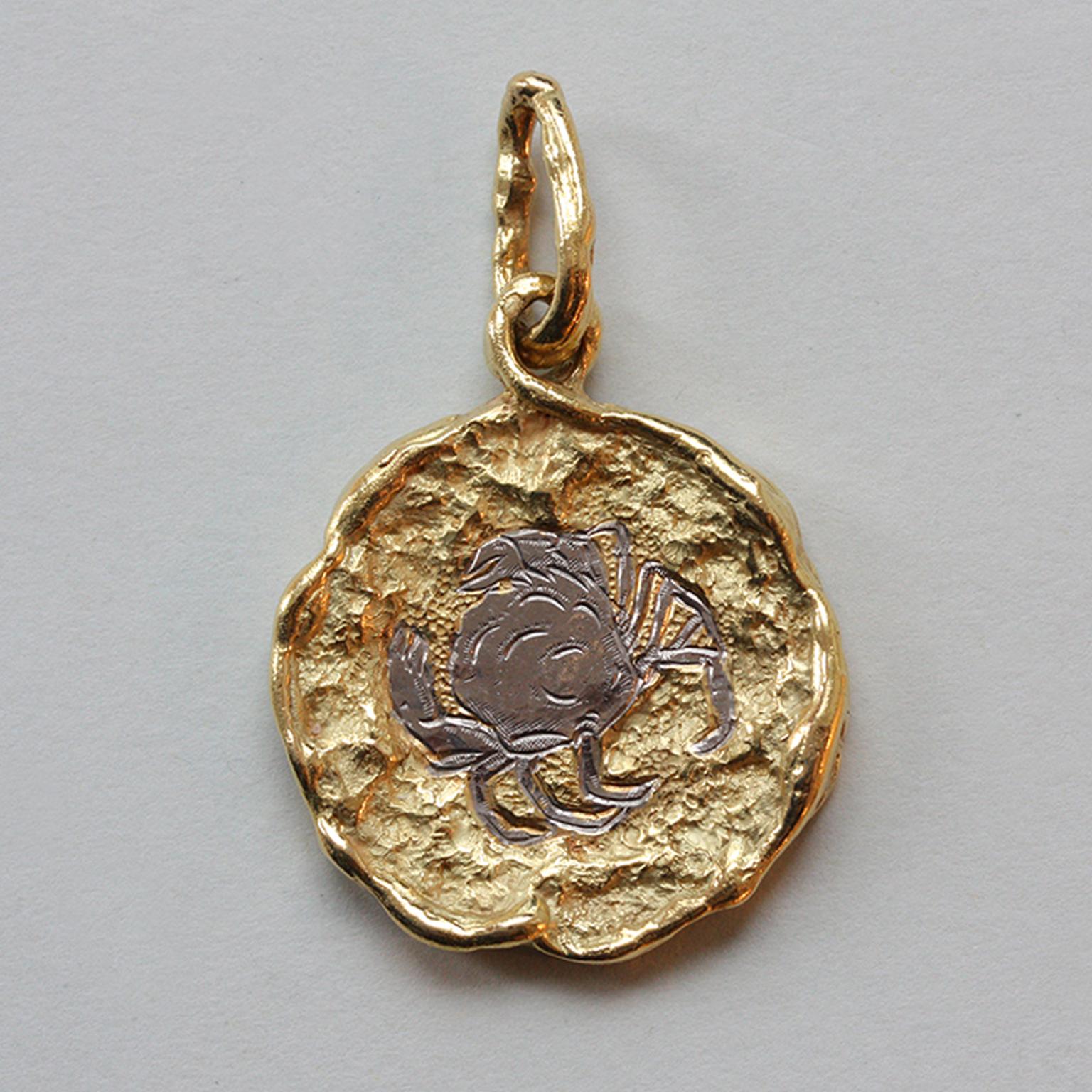 A bi-color 18 carat gold brutalist textured Cancer pendant, signed: Chaumet, Paris, France, circa 1970.

weight: 31.3 grams
dimensions pendant: 4.5 x 3 cm