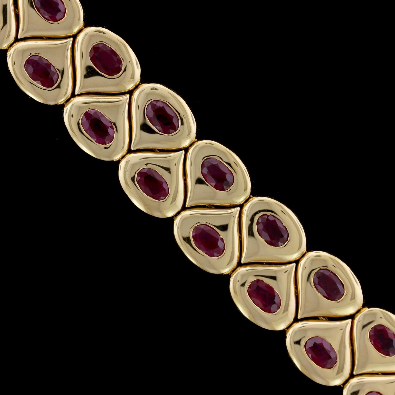 Chaumet 18K Yellow Gold Ruby Bracelet, Paris. The flexible polished link bracelet is flush set with 28 oval cut rubies, approx. total wt. 17.00cts., #163740, length 7