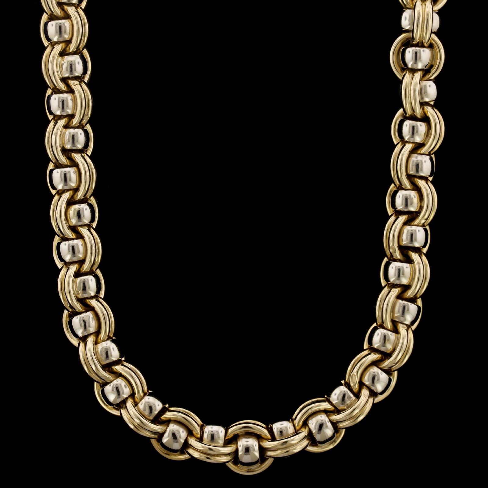 Chaumet 18K Two-tone Gold Necklace, Paris. The necklace is designed with ribbed
and circular polished links, #143075, length 17