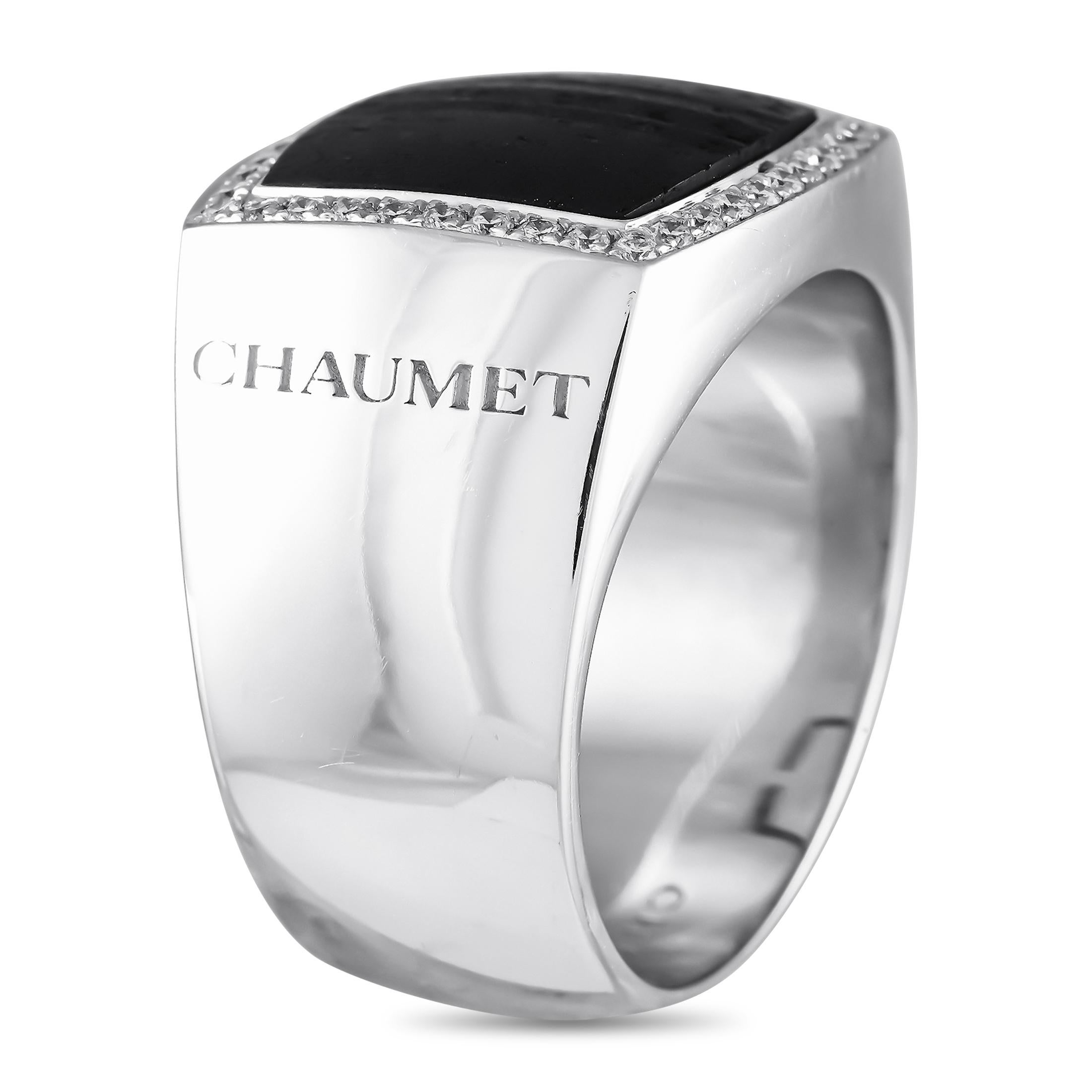 Substantial in size, weight, and finger presence, this Chaumet ring for men is the perfect choice for the gentleman who isn't afraid to stand out. This chunky ring in white gold features a polished finish with a black, square-shaped wood center