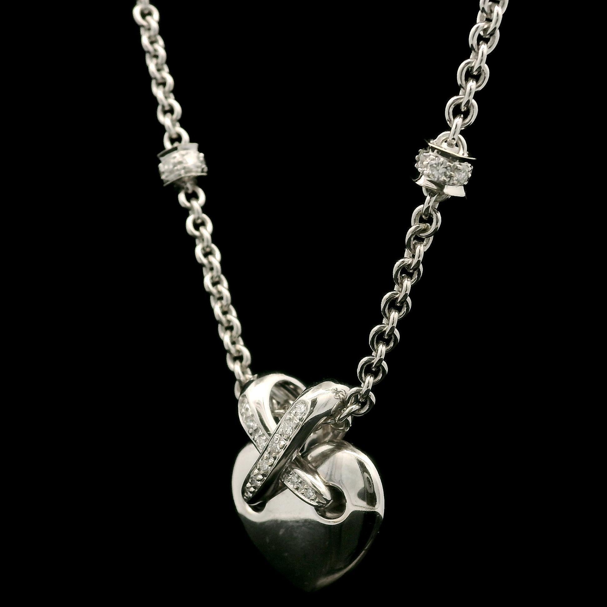 –Stone(s)–
(35) Natural Genuine Diamonds - Round Brilliant Cut - Pave Set - F-H Color - VS-SI Clarity - 0.50ctw (approx.)

Material: Solid 18k White Gold
Weight: 16.98 Grams
Chain Type: 16” - Station Cable link - Lobster Clasp
Pendant Height: 18.5mm