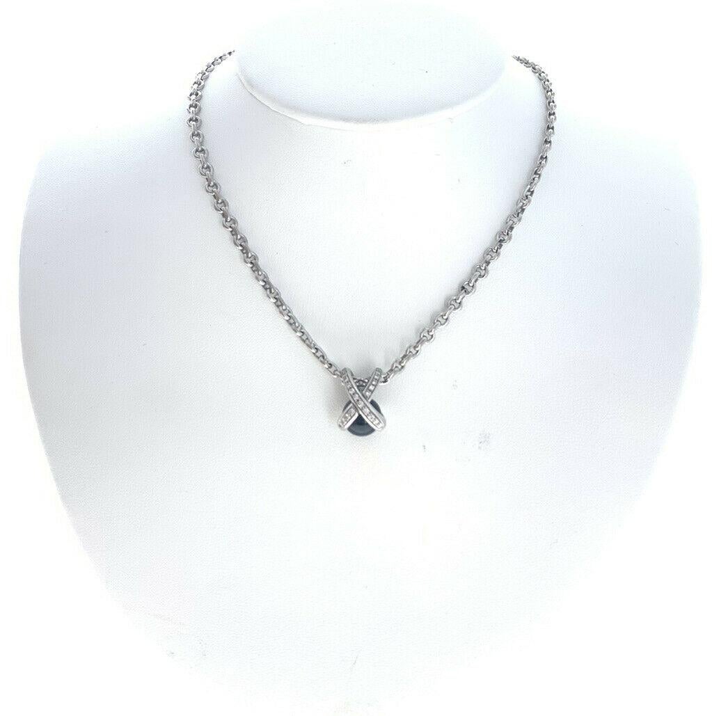 Chaumet 18k White Gold, Diamond & Onyx X Pendant Necklace 26.8g

For sale is a Chaumet 18k white gold and diamond X pendant necklace. 
This super chic piece comes on a 15 'inch chain.
 Perfect worn day or night.
 Get this stunning necklace