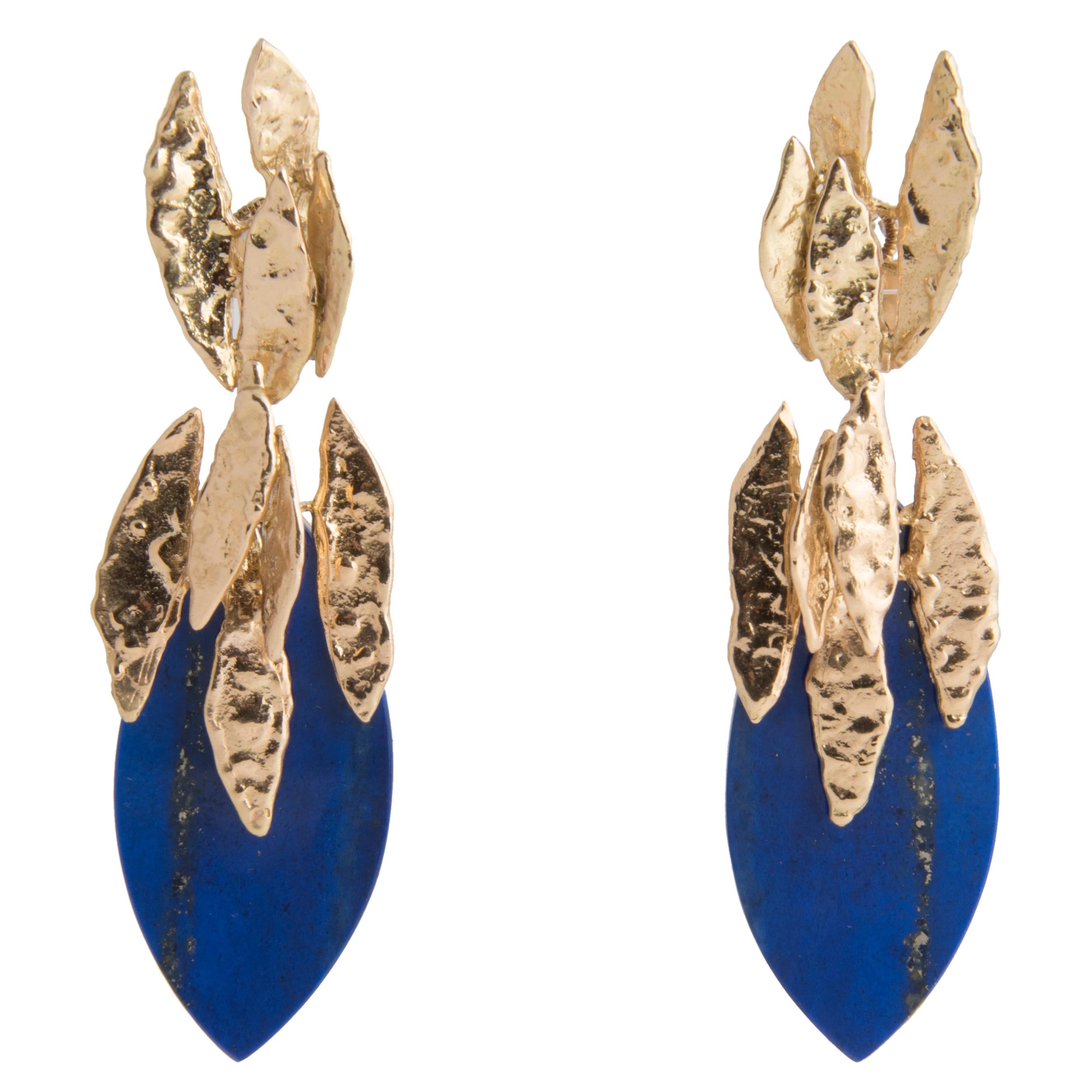 Stylish pair of clip-on drop earrings by Chaumet Paris, designed as 18k textured gold leaves holding amazing quality pointed oval Lapis Lazuli plaques
Signed Chaumet Paris, marker's mark, French hallmarks
1970s

These earrings were most probable
