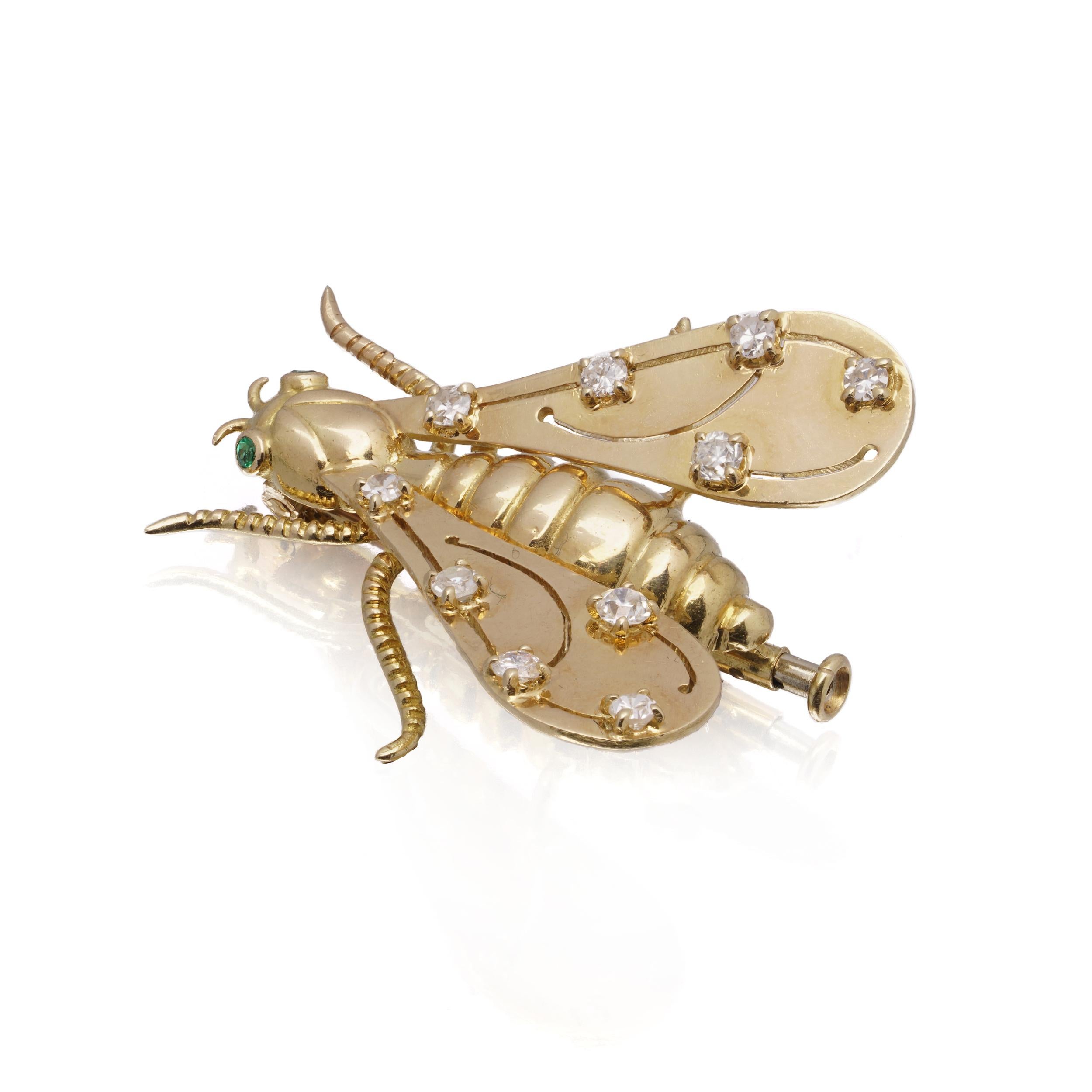 A beautifully crafted vintage insect brooch by Chaumet, Paris, modelled in 18kt yellow gold with finely articulated wings set with brilliant-cut diamonds and emerald eyes. Signed CHAUMET with French hallmarks and fitted with a double-pin clasp to