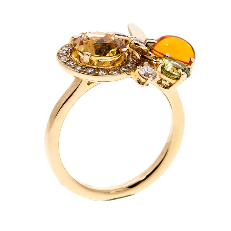 Chaumet's Attrape Moi ring is graceful and sophisticated. It is finely sculpted from 18K yellow gold and designed with a beautiful combination of stones, namely, diamond, citrine, fire opal, peridot, pink tourmaline and each one complements the