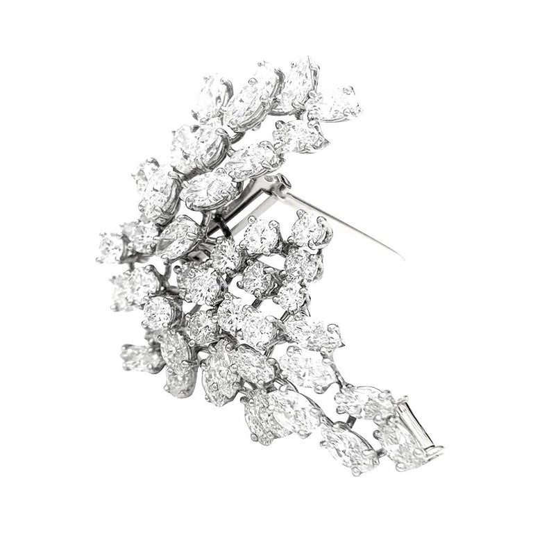 A platinum Chaumet brooch, set with brilliant and navette cut diamonds.
18K white gold pins.
Quality stones : E/F - VVS
Weight: 16,2 grams.
Signed and Hallmark
Circa 1960