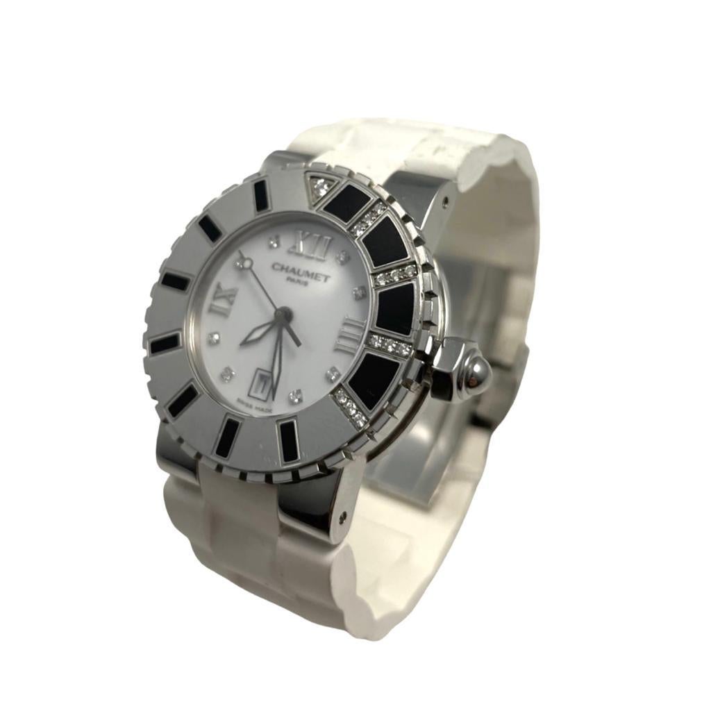 Brand: Chaumet

Model Name: Class One

Movement: Automatic

Case Size: 32 mm

Case Back: Solid

Case Material: Stainless Steel

Bezel:  Stainless Steel With Diamonds

Dial: White

Bracelet:  Rubber

Hour Markers:  Roman Numerals and