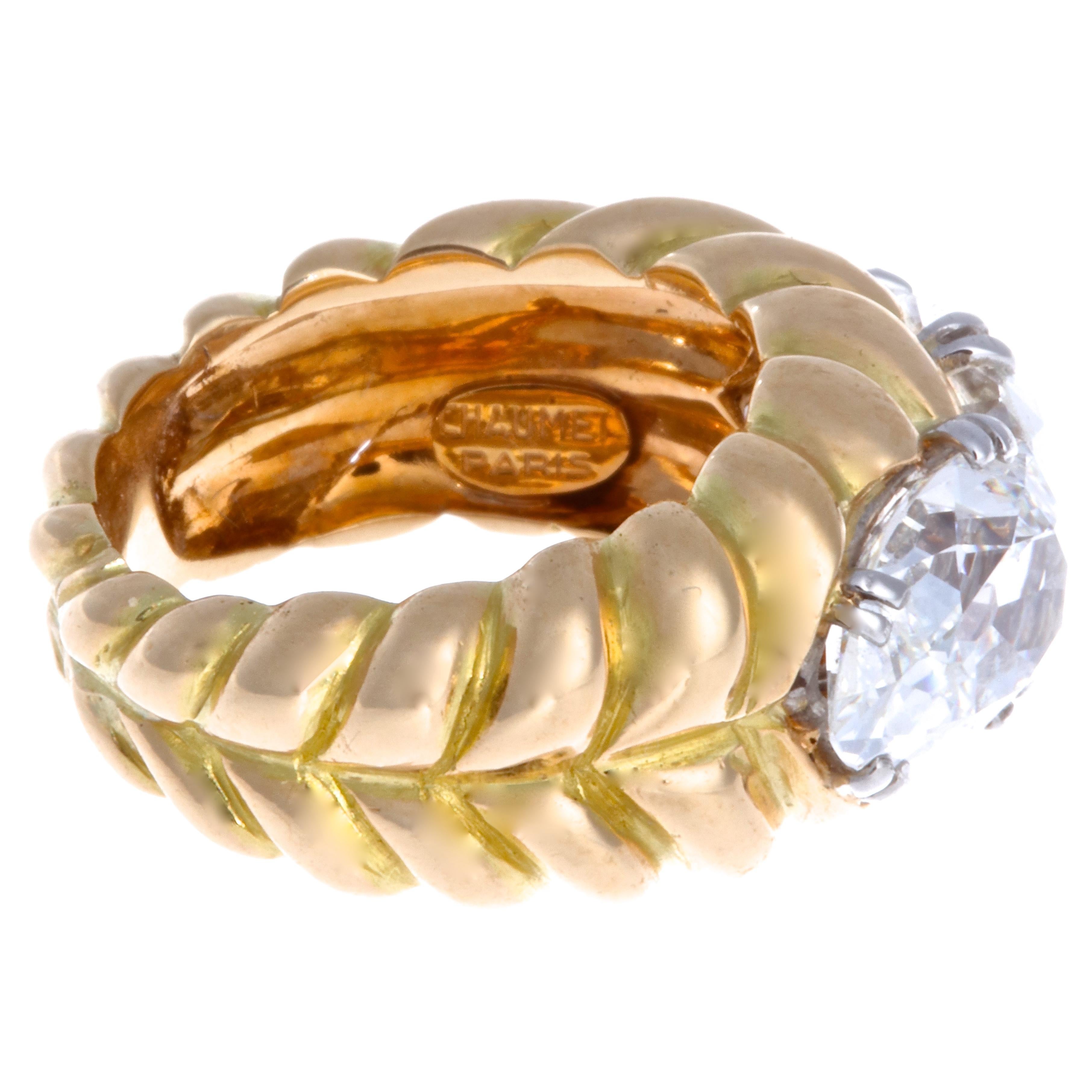 If you like solid gold pieces, accented by diamonds, this Chaumet diamond 18k gold ring will be the highlight of your collection. An iconic, eye-catching look that attracts compliments. The ring is accented by 2 pear shaped diamonds, GIA 2.02 G