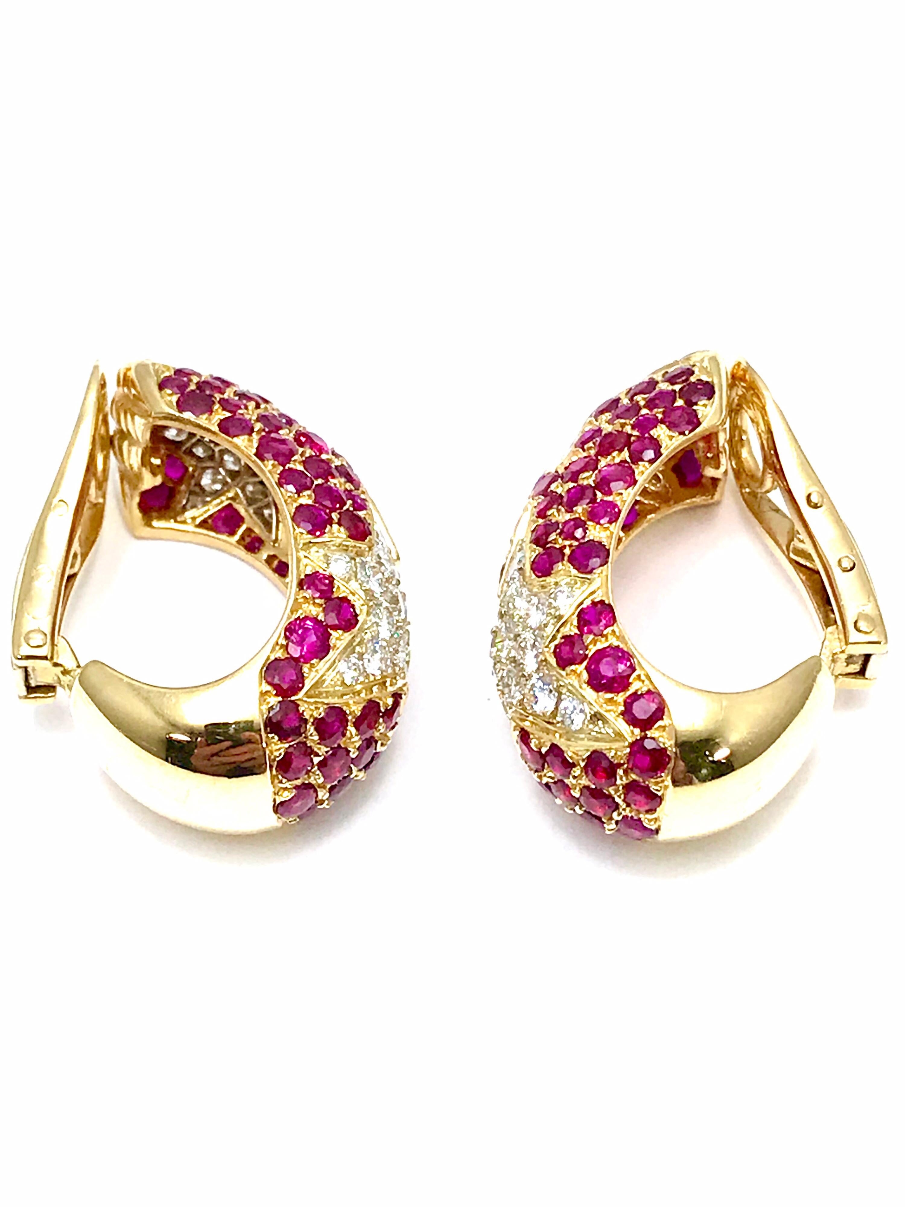 A fabulous pair of earrings, created by Chaumet.  Boasting 3.90 carats in vibrant red Rubies, and 1.80 carats in round brilliant Diamonds, these earrings are simply stunning.  The diamonds are set in a star shape, with two on each ear.  The back is