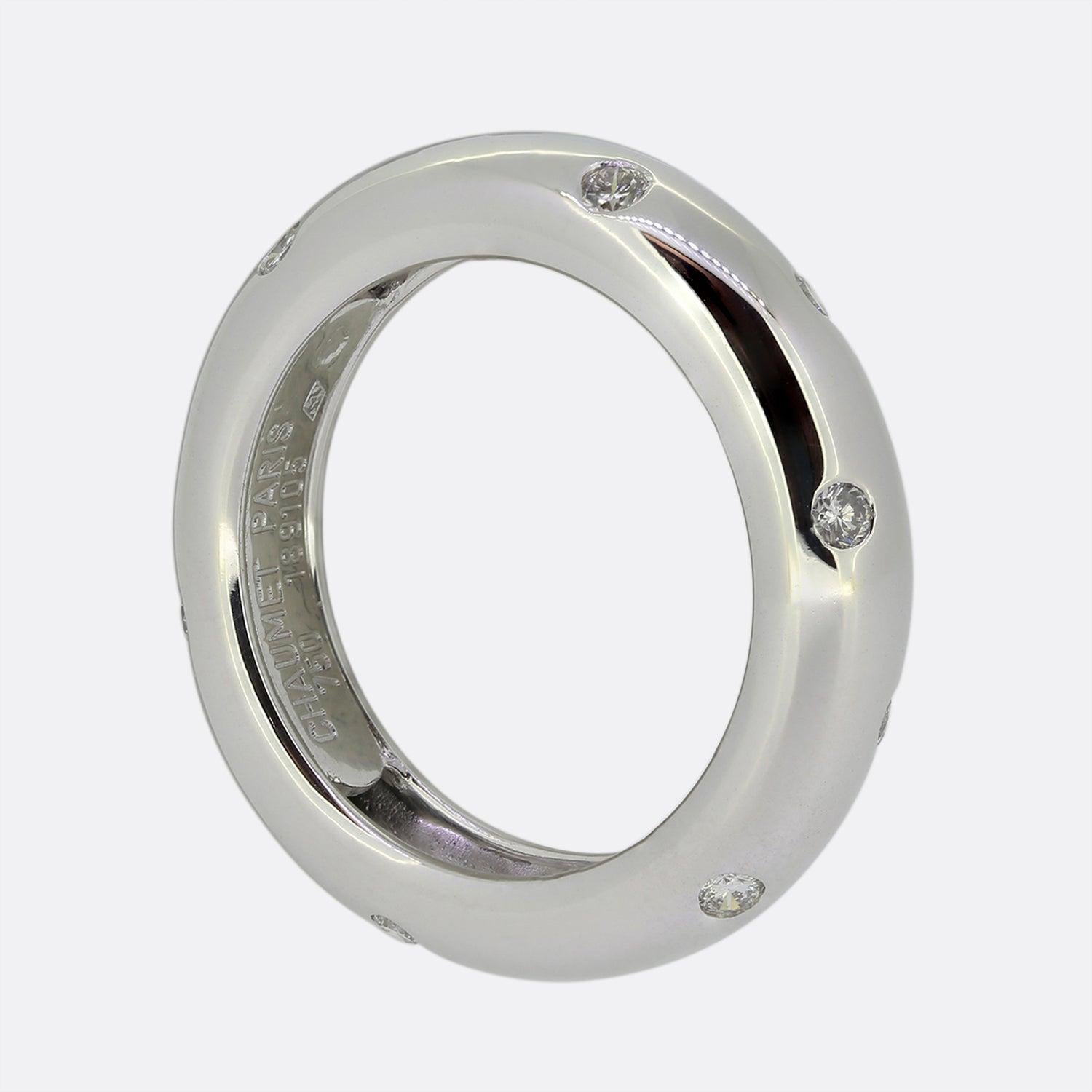 This is an 18ct white gold ring from the world renowned jewellery designer Chaumet. The ring is in a simple band style and features 12 round brilliant cut diamonds that are flush set, making it very practical to wear.

Condition: Used