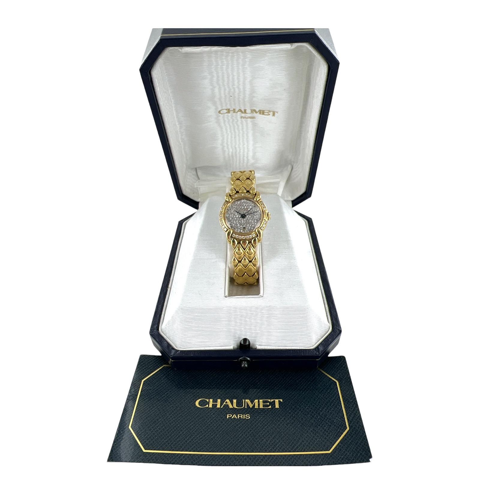Beautiful and elegant diamond Chaumet watch crafted in 18 karat yellow gold. The diamond bezel is factory,  and the diamonds on the dial were added after market. The diamonds weigh approximately 1.25 carat total weight. The watch is quartz, 26mm