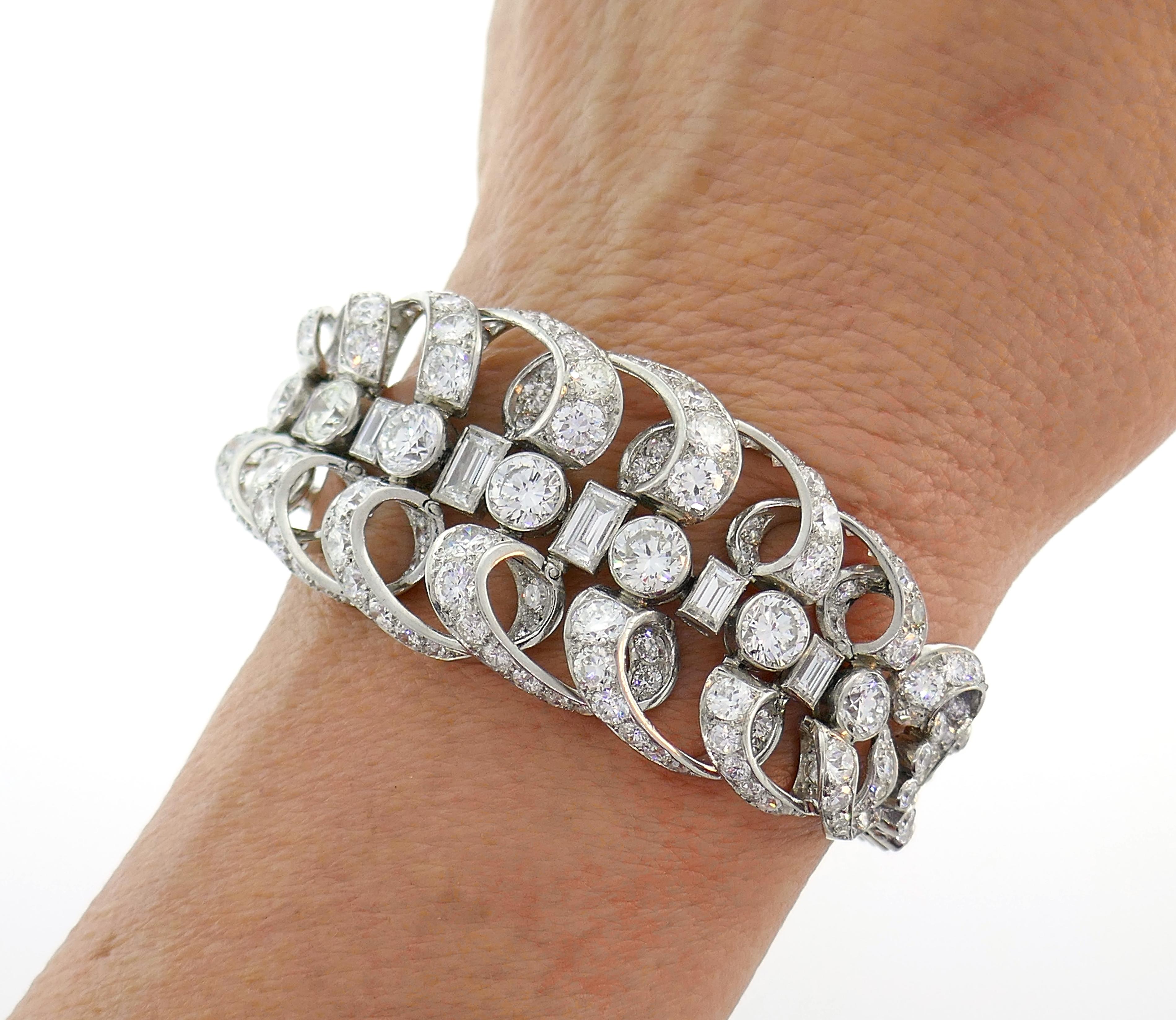 Stunning late Art Deco bracelet created by Chaumet, Paris in the 1930s. It is made of platinum and set with transitional round brilliant cut and baguette cut diamonds. The diamonds are of F-G-H color VS clarity, total weight is approximately 18.50