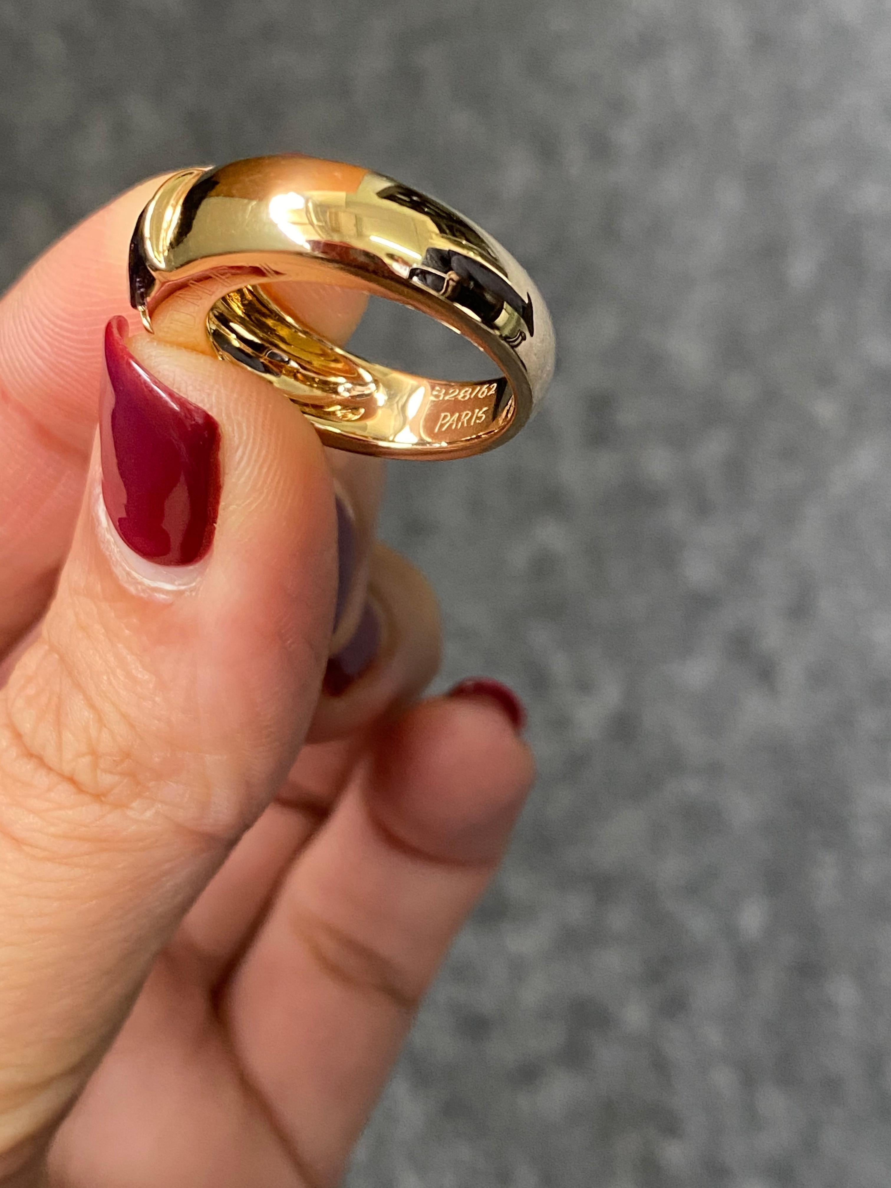 Signed Chaumet band ring, with Iolite set in 18K yellow gold. The ring is sized at US 6. 
Pre-owned.
Message for more information/video. 
Free shipping provided. 
We accept returns. 