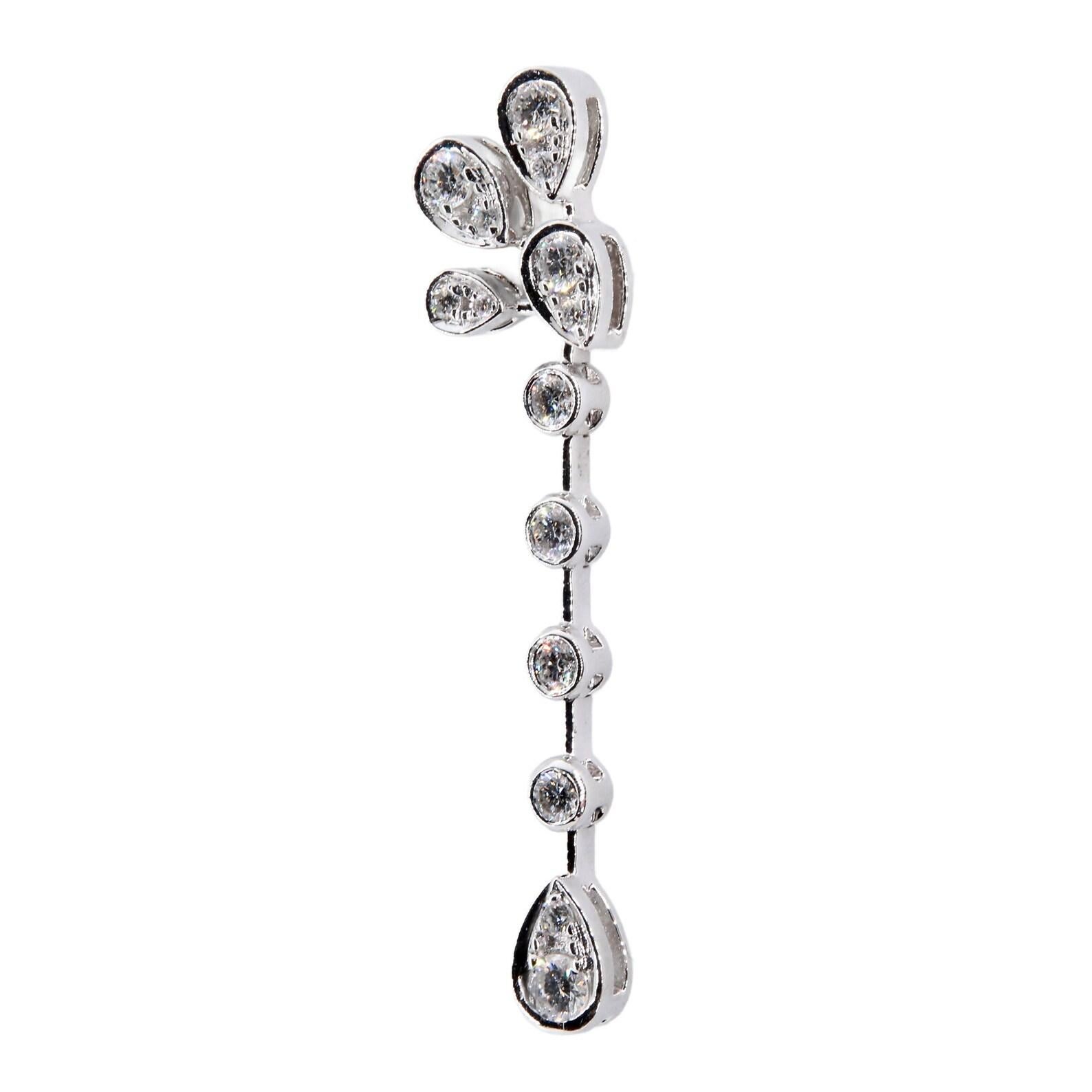 A pair of Chaumet diamond dangle earrings crafted in 18 karat white gold. From the Josephine Aigrette Impériale collection, these beautiful earrings are set with 2.10 carats of round brilliant cut diamonds. Diamonds grade as G color, VS