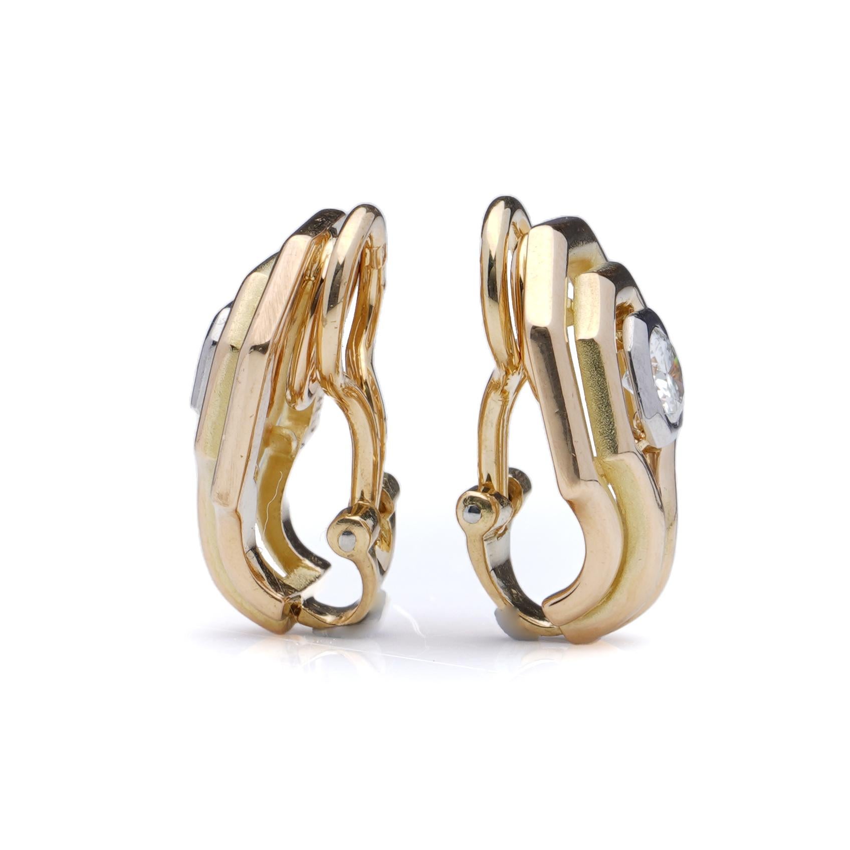 Chaumet ladies 18kt yellow gold clip-on earrings set with stunning diamonds. 
Made in France, Ca. 1970's 
Fully hallmarked. 

Dimensions - 
Size: 1.7 x 1.4 x 1 cm 
Weight: 10.82 grams 

Diamonds -  
Cut: Round Brilillant Cut 
Quantity of stones: 2
