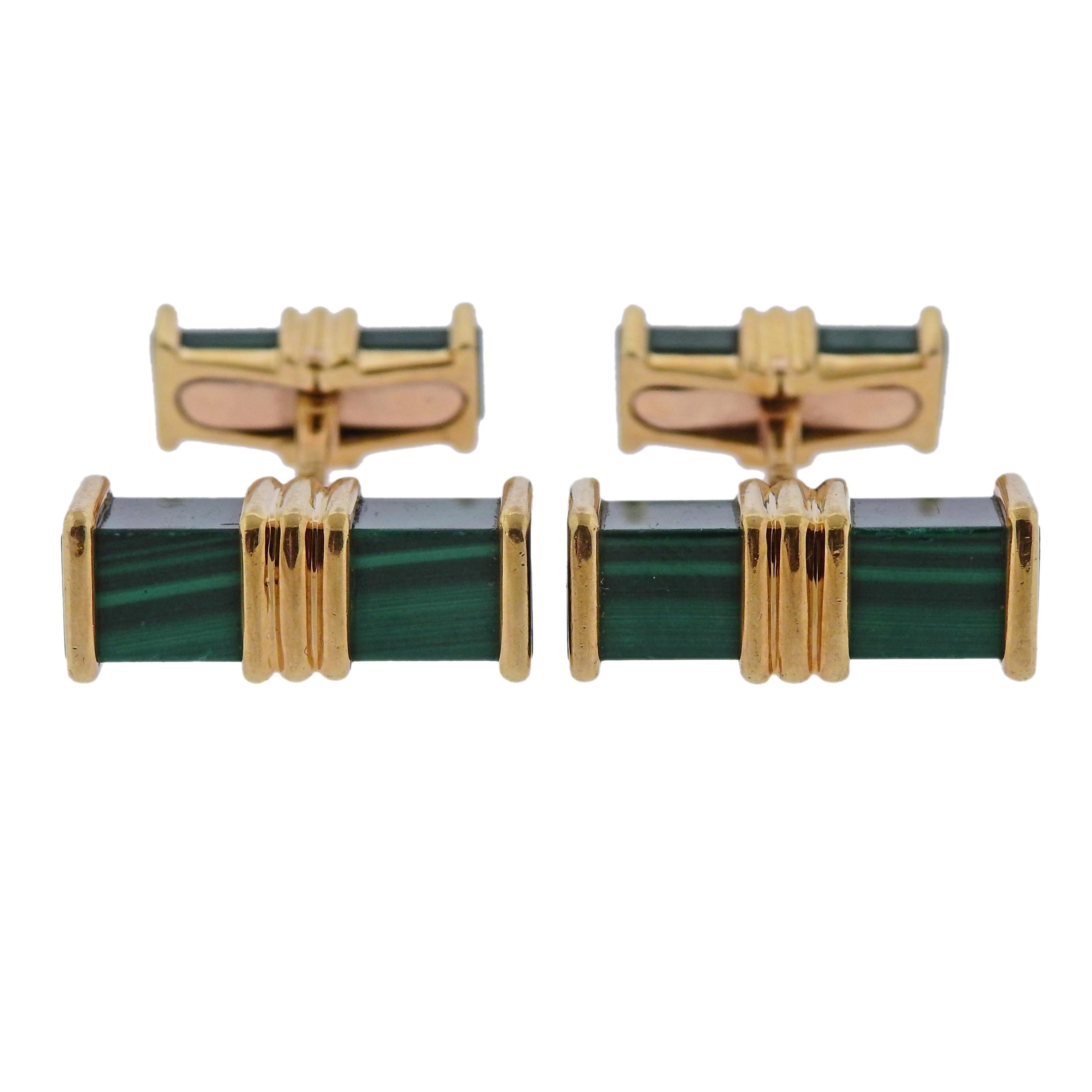 Pair of 18k yellow gold cufflinks, crafted by Chaumet, with malachite stones. Cufflink top measures 20mm x 7mm, back - 15mm x 5mm, weigh 18.4 grams. Marked:  Chaumet, 750, 23548.