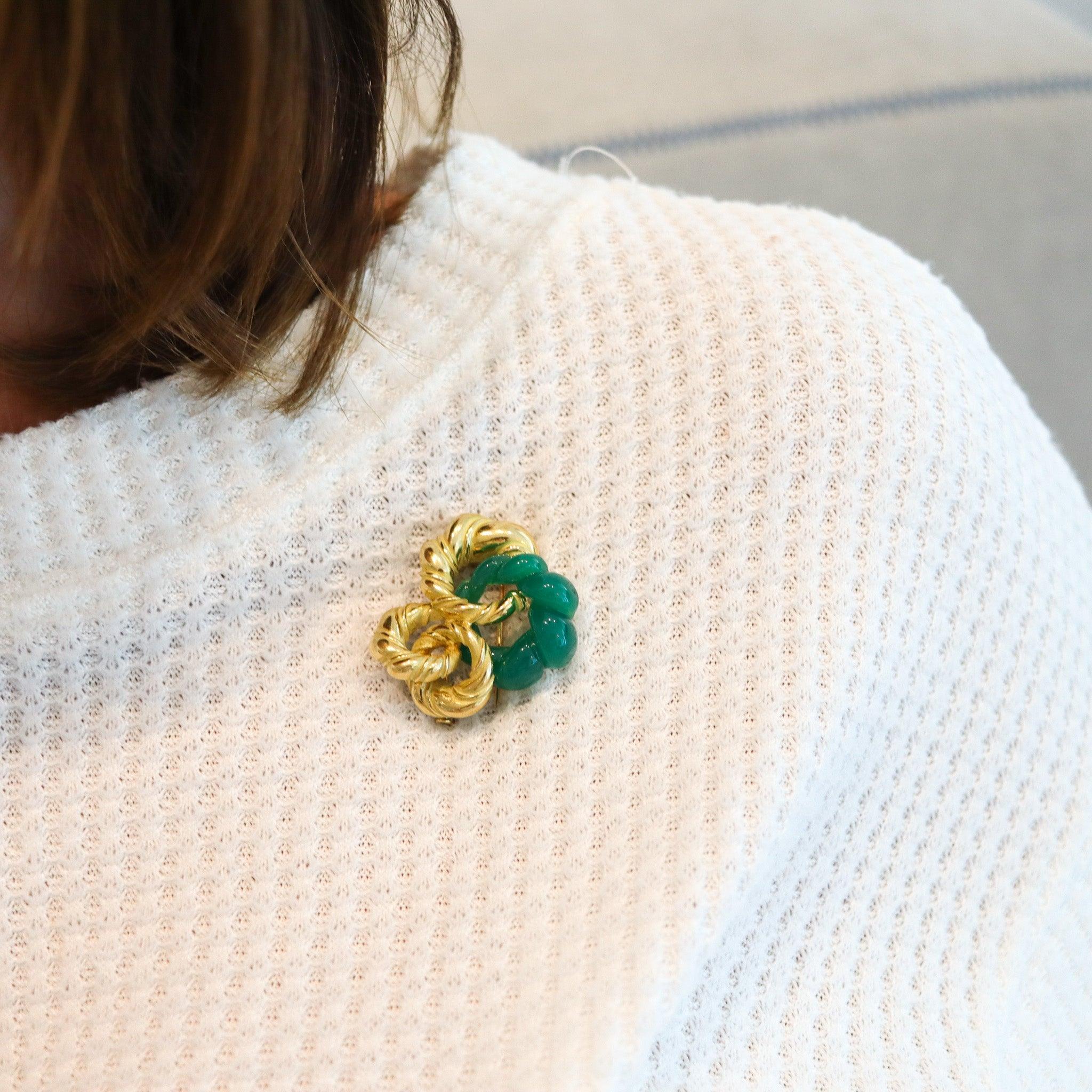 A modernist brooch designed by Chaumet.

This is a beautiful retro-modernist brooch, created in Paris France by the jewelry house of Chaumet, back in the 1970. The sculptural brooch has been made up, with an arrange of four sculpted elements of