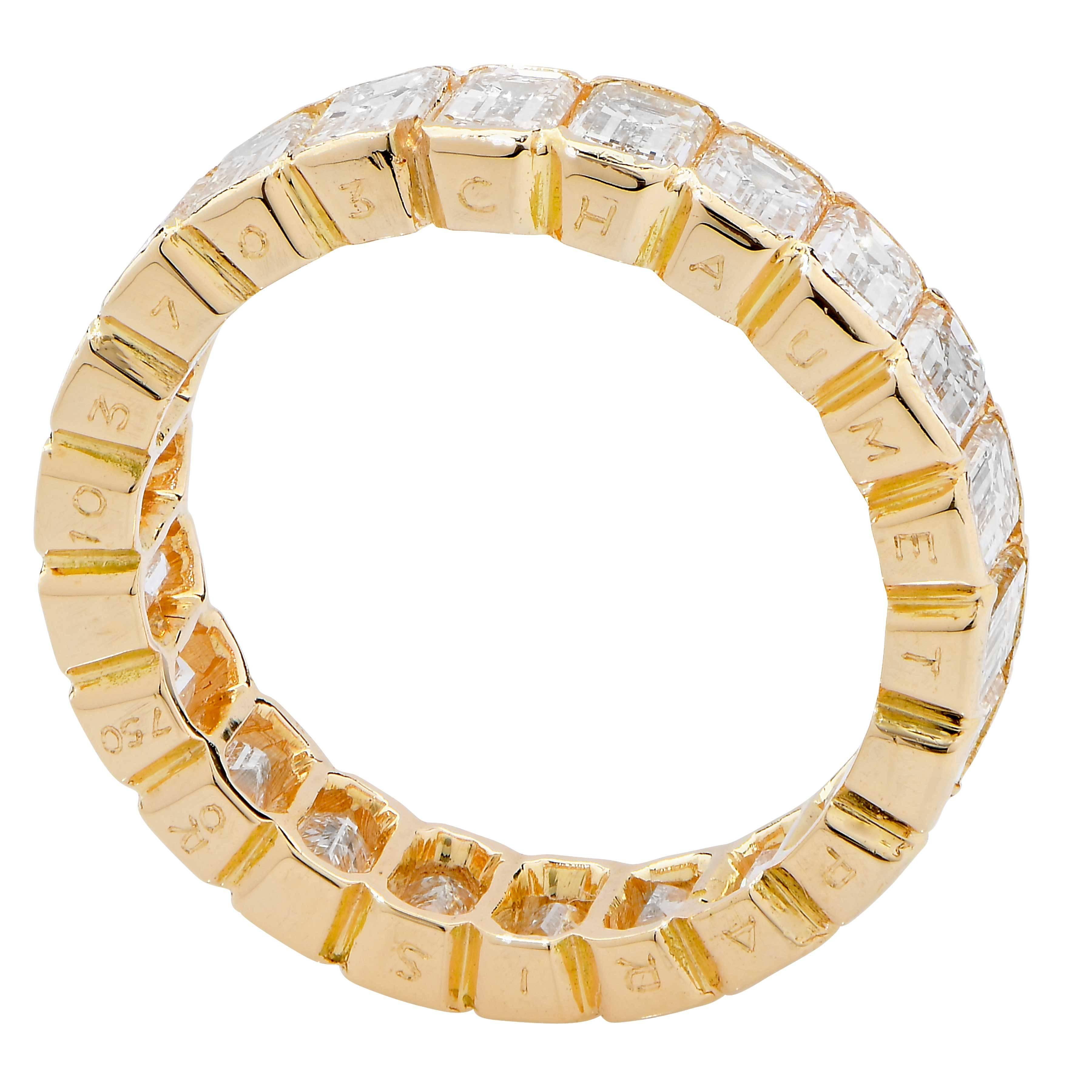4 Carat Emerald cut diamond eternity band by Chaumet, Paris in 18 Karat Yellow Gold.
This wonderful eternity band features 22 emerald cut diamonds F/G in color VS clarity with a total estimated weight of 4 carats. The diamonds are partially bezel