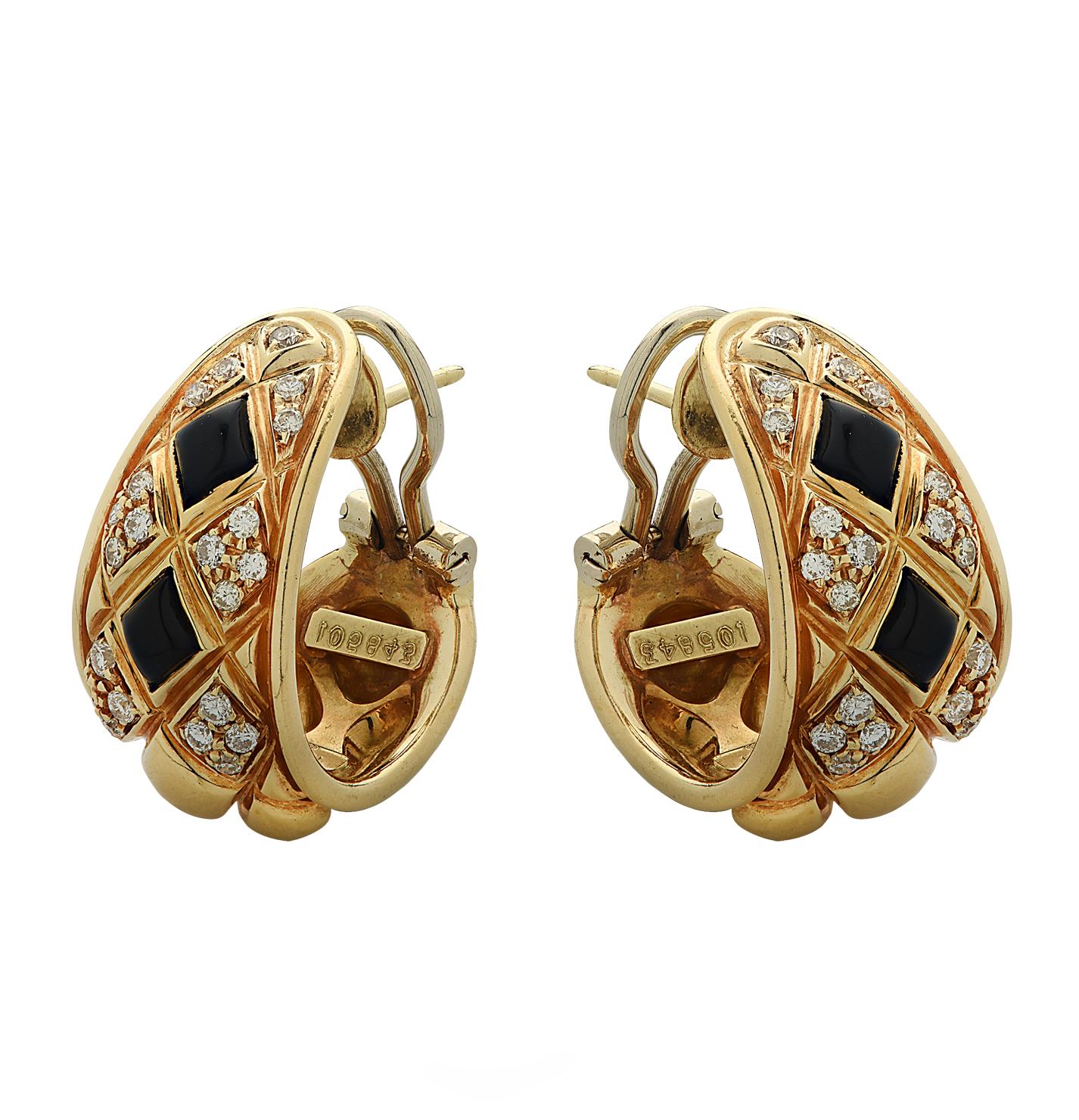 Striking Chaumet Paris hoop earrings crafted in 18 karat yellow gold. The quilted hoops are adorned with onyx and 40 round brilliant cut diamonds weighing approximately  .70 carats total, G color, VS clarity. These stunning earrings have posts and