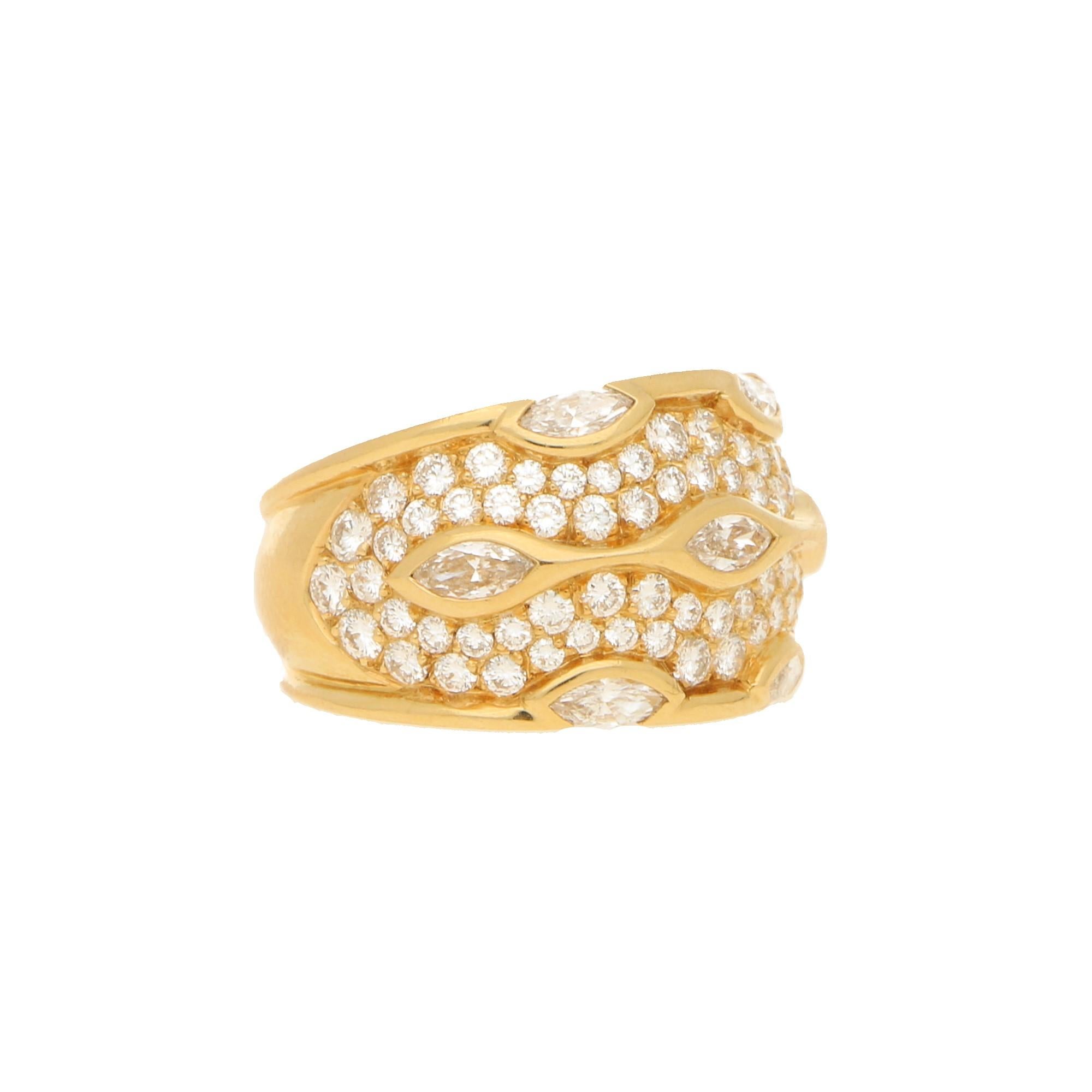 A beautiful Chaumet Paris diamond bombe ring set in 18k yellow gold.

The ring is pavé set throughout with 76 round brilliant cut diamonds. Set on top of the round diamonds are 7 single marquise cut diamonds which are all rub over set securely in