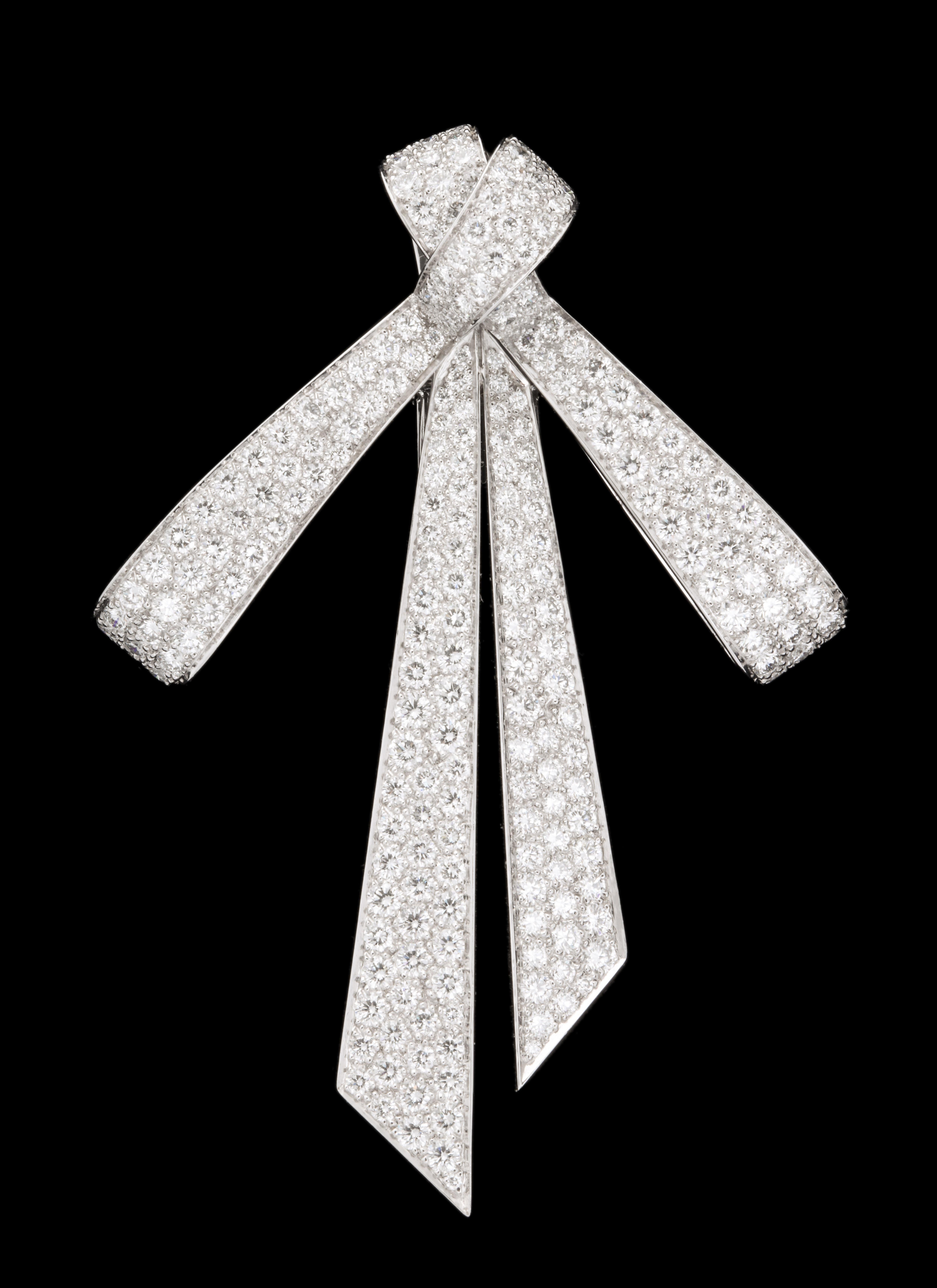 Elegant, classic and timeless from one France's most elite jewelers.
18kt white gold and diamond.
Double pin and safety mechanism.
Signed, hallmarked and numbered for authenticity.
Circa 2008

