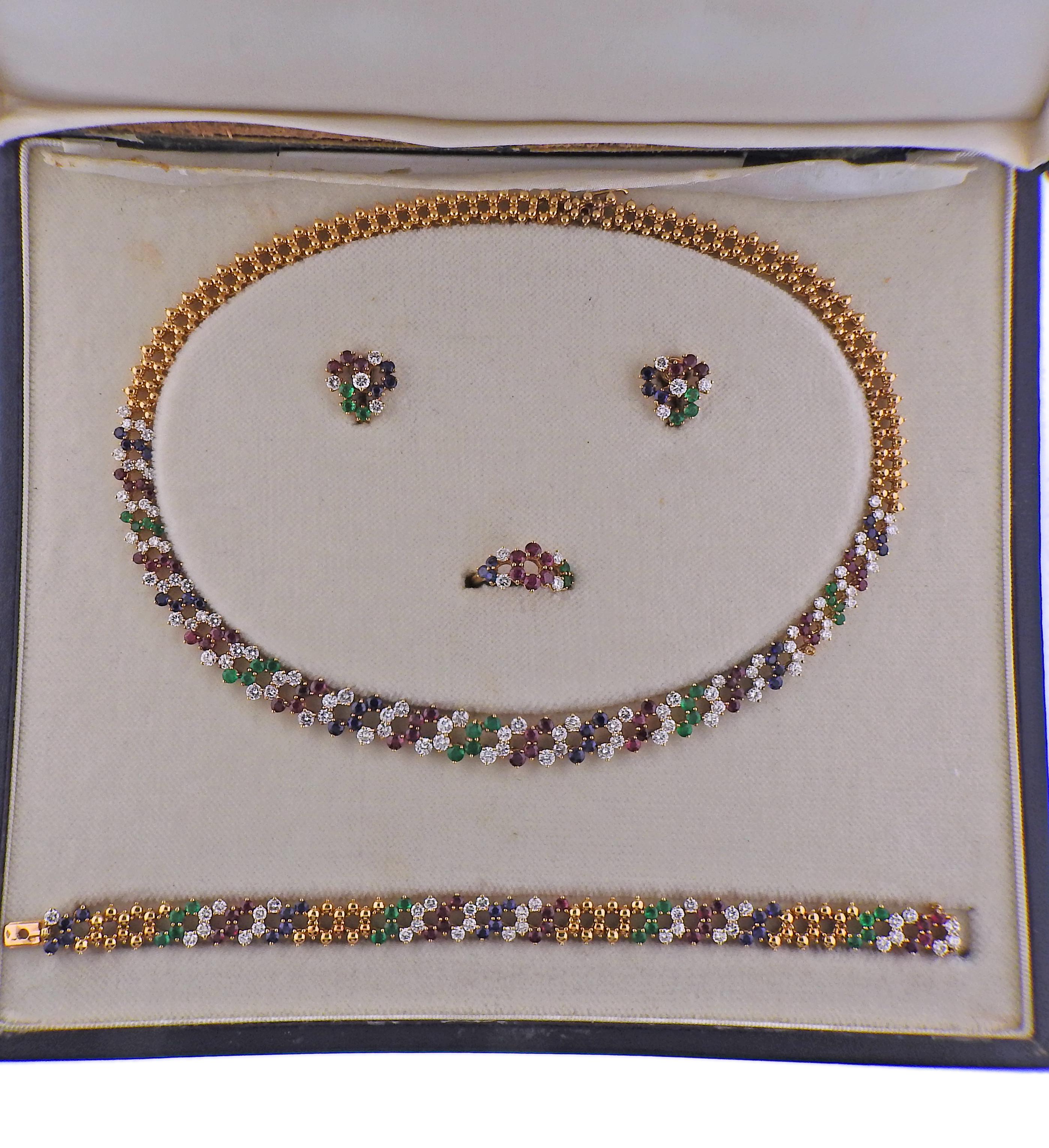 Important vintage 18k gold parure set by Chaumet Paris, featuring necklace, bracelet, ring and a pair of earrings. All come in vintage fitted original box by Chaumet. Decorated with approx. 9.50-10ctw in G/VS diamonds total, rubies (one stone is