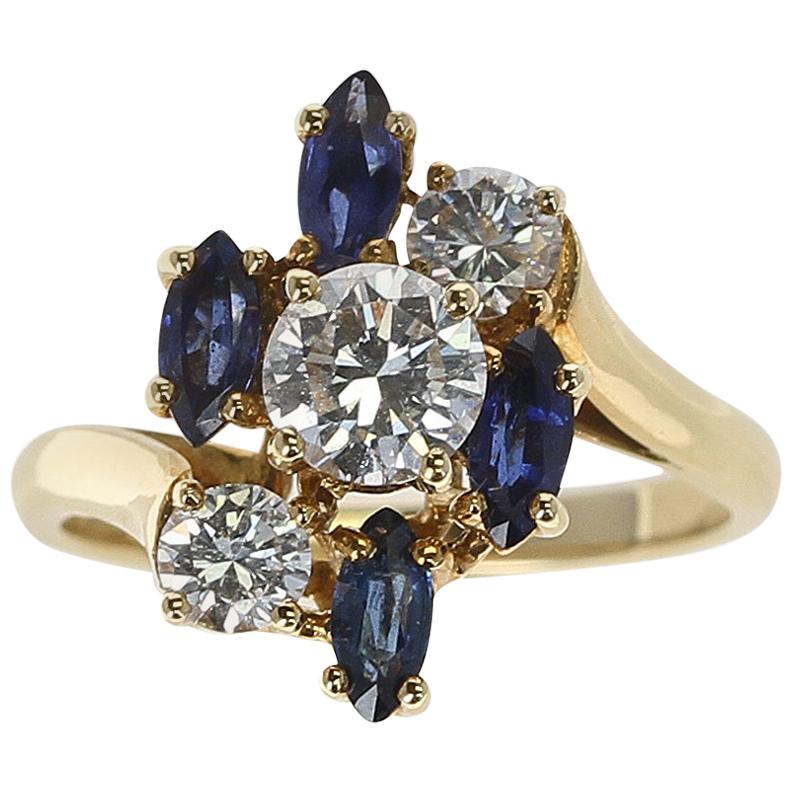 Chaumet, Paris Marquise Sapphire and Round Diamond Ring, 18 Karat Yellow Gold For Sale
