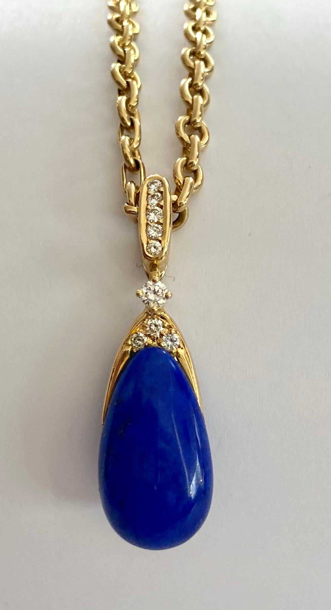 One 18 Karta yellow gold Pendant and Chain, stamped: 750 & Chaumet Paris 
Pendant has one 12.00 carat drop, cabuchon natural Lapis Lazuli (not treated) and 9 brillant cut diamonds weihgting: 0.25 ct. VVS-VS  - F Color.
Chain = 44.5 cm ( 17.2 inch)