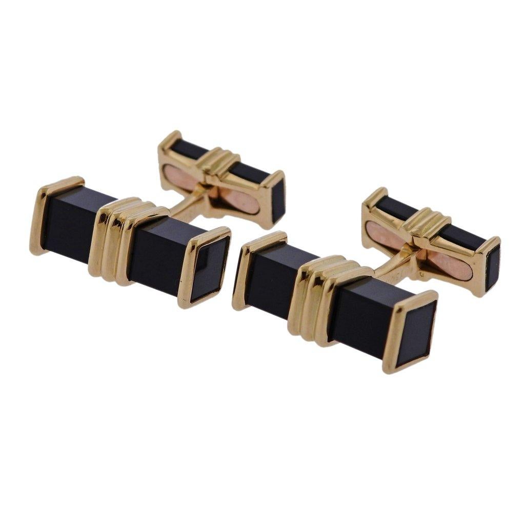 Pair of French 18k gold cufflinks, crafted by Chaumet, set with onyx (tiny chip on one of the onyx, on the back). Cufflink top - 20mm x 7mm, back - 15mm x 5mm, Cufflinks weigh 16.1 grams. Marked Chaumet, Paris, 1304 G, French gold assay marks.