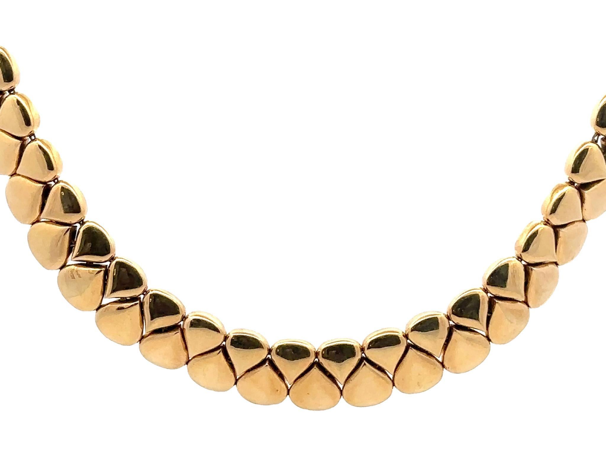 The Chaumet Paris Heavy Choker Necklace is a statement piece from the 1950s, made in 18-karat yellow gold, weighing 124.9 grams. 
This gorgeous necklace represents the fine French jewelry design from the mid-20th century. 

Signed by Chaumet Paris,