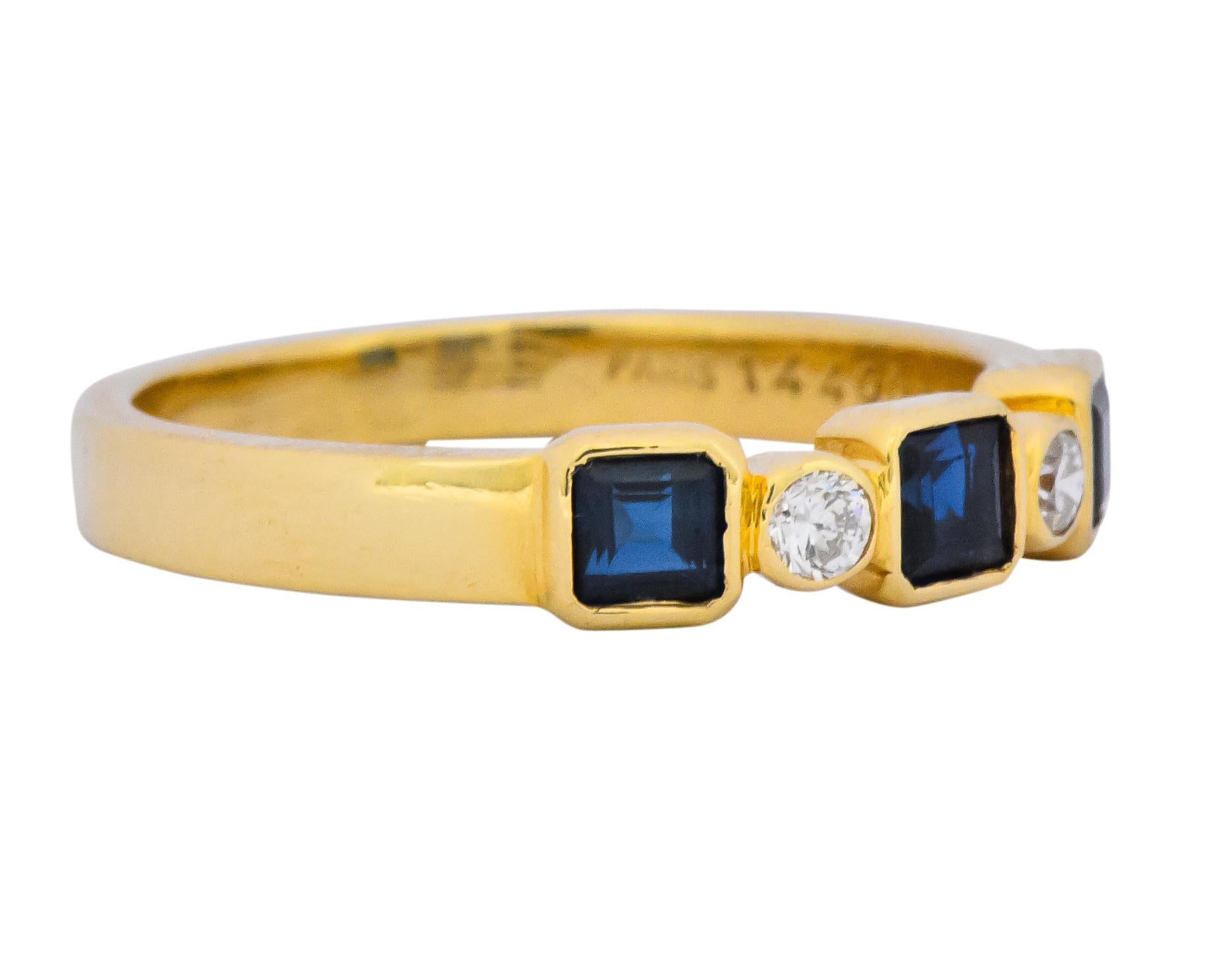 Featuring sapphires and diamonds, bezel set to the front in band style ring

Centering three square cut sapphires weighing approximately 0.20 carat total, transparent inky blue in color

With two round brilliant cut diamonds weighing approximately
