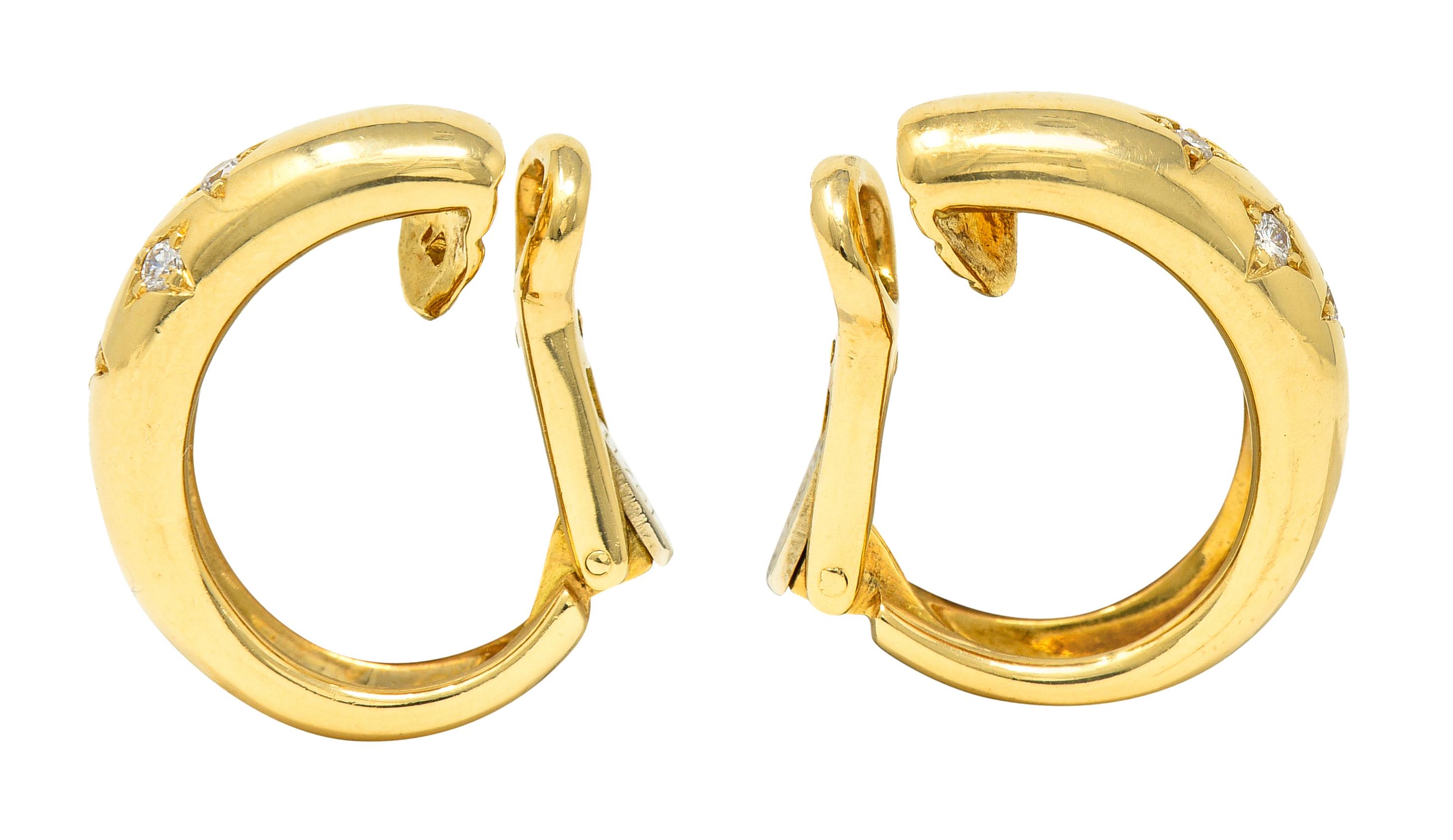 Ear-clip earrings are designed as high polished gold half-hoops with star motif

Featuring four bead set round brilliant cut diamonds in each star

Weighing approximately 0.24 carat total - G/H in color with VS clarity

Completed by hinged omega