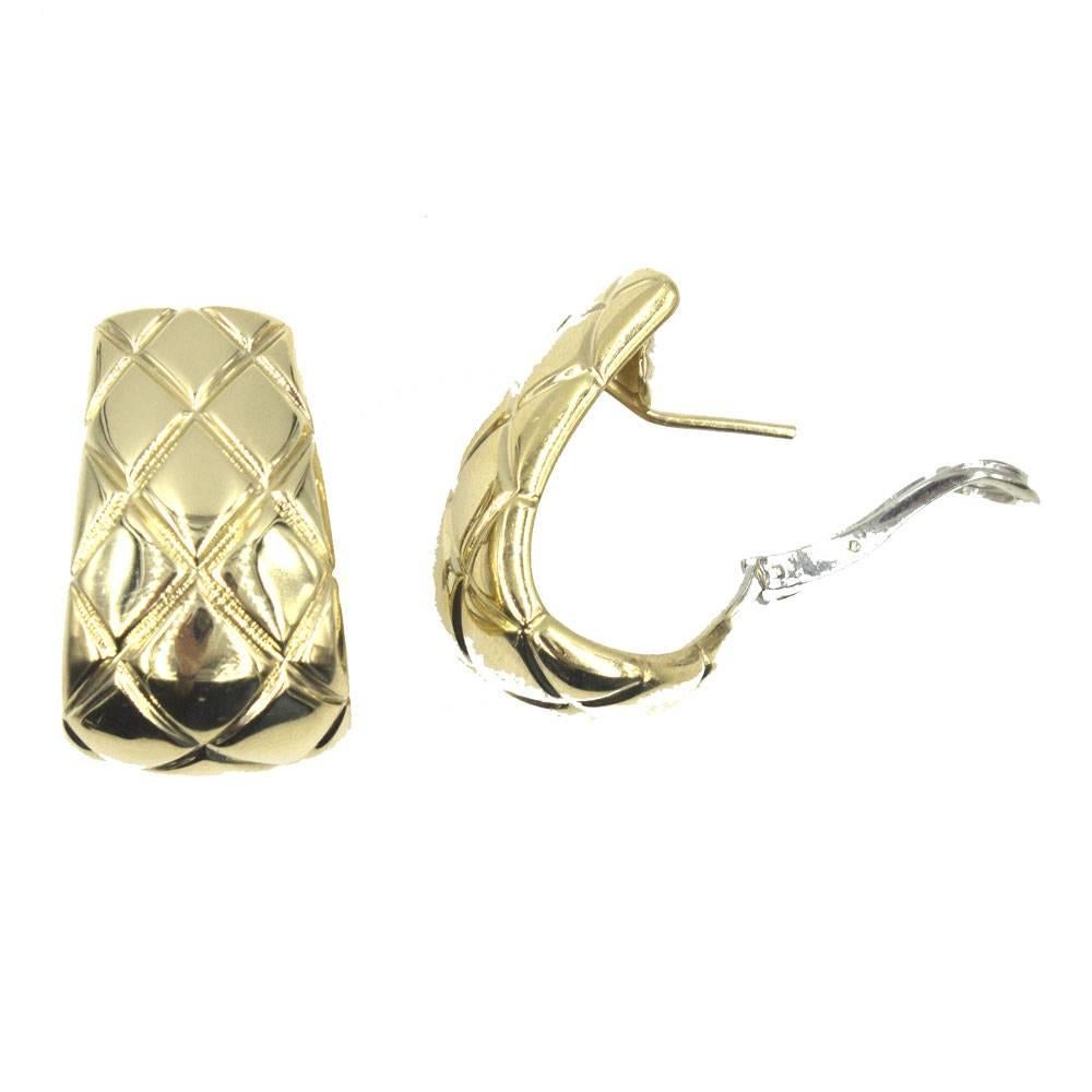 Timeless and classy earrings by Chaumet. The half hoop earrings are crafted in 18 karat yellow gold and feature a quilted pattern. They measure 1.0 inch in length and .70 inches in width. Signed, numbered, and hallmarked (please see photos).