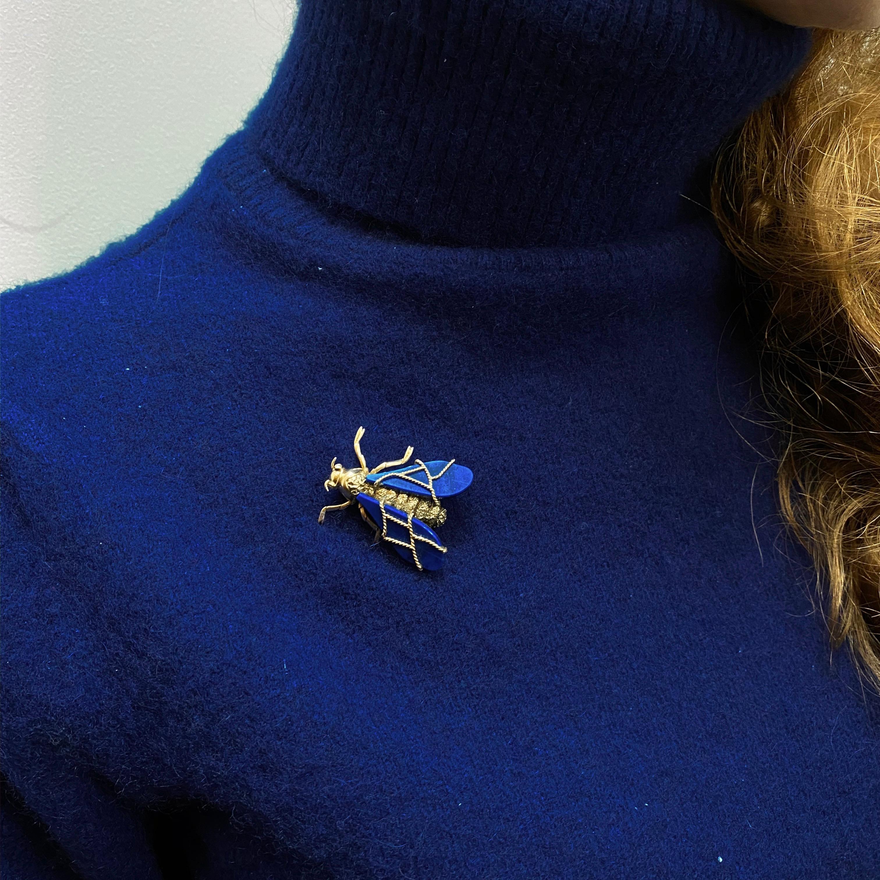 Chaumet Vintage Lapis Lazuli and Diamond Queen Bee Brooch in 18 Karat Yellow Gold, 1970s. This brooch is modelled as a queen bee ready to fly, with lapis lazuli wings detailed with twisted yellow gold rope veins, leading to the ridged body with a