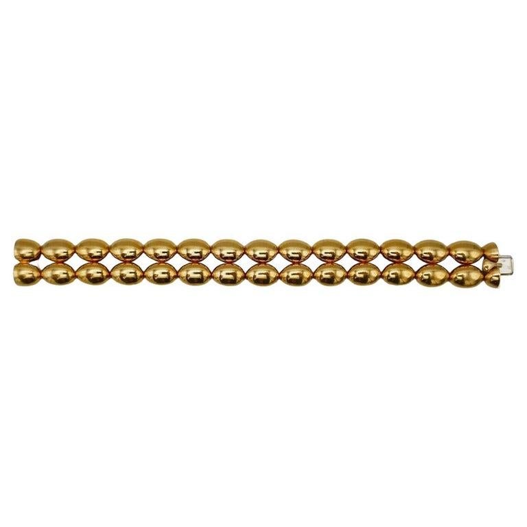 A gorgeous vintage bracelet by Chaumet. Made of 18k polished yellow gold scalloped shape links connected with each other by hinges. Stamped with Chaumet maker's mark, a hallmark for 18k gold, a French marks and a place of origin