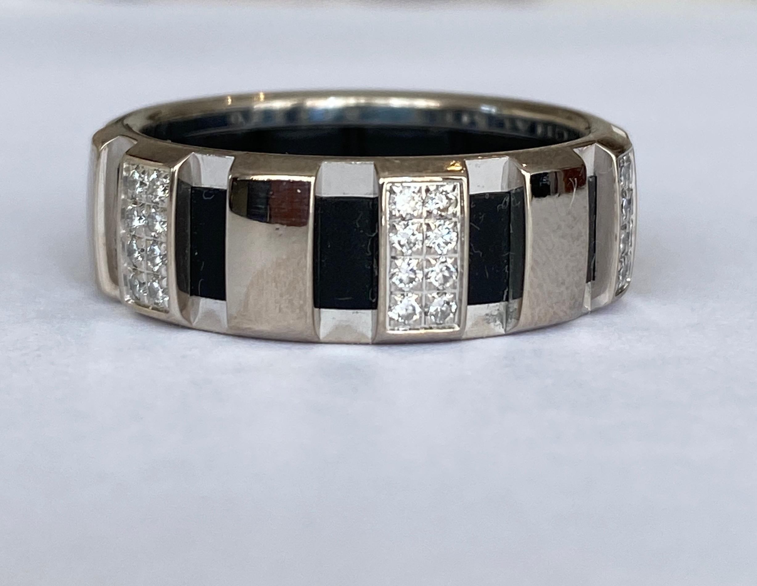 Chaumet White Gold Diamond Class One Ring 
An 18k white gold diamond ring by Chaumet from the Class one collection. The ring comprises of round brilliant cut diamonds in a pave setting on each rectangle shaped segment with a rubber band on the