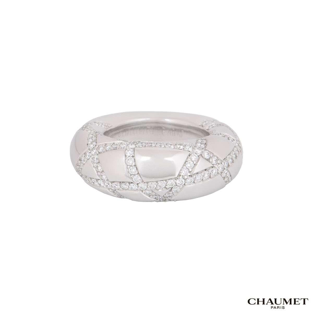An 18k white gold diamond dress ring by Chaumet. The ring features a round brilliant cut diamond set crossover pattern. The diamonds have a total weight of approximately 1.20ct, G+ colour and VS+ clarity. The ring measures 9mm in width, is a size UK