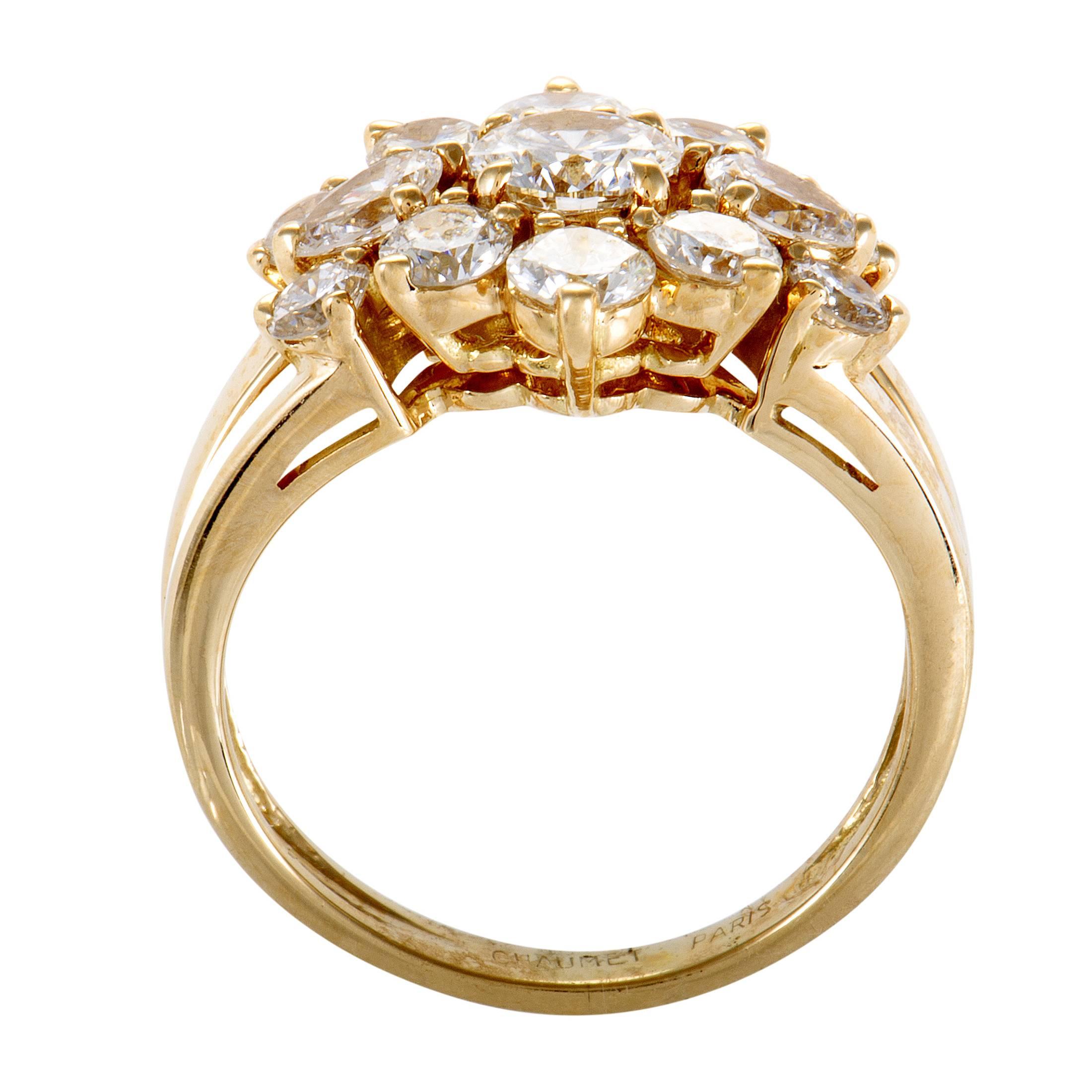 Tasteful, lavish and simply majestic, the fantastic arrangement of F-color diamonds of VS clarity weighing in total 2.10 carats gives this gorgeous 18K yellow gold ring from Chaumet an irresistible aura of radiant femininity and resplendent beauty.