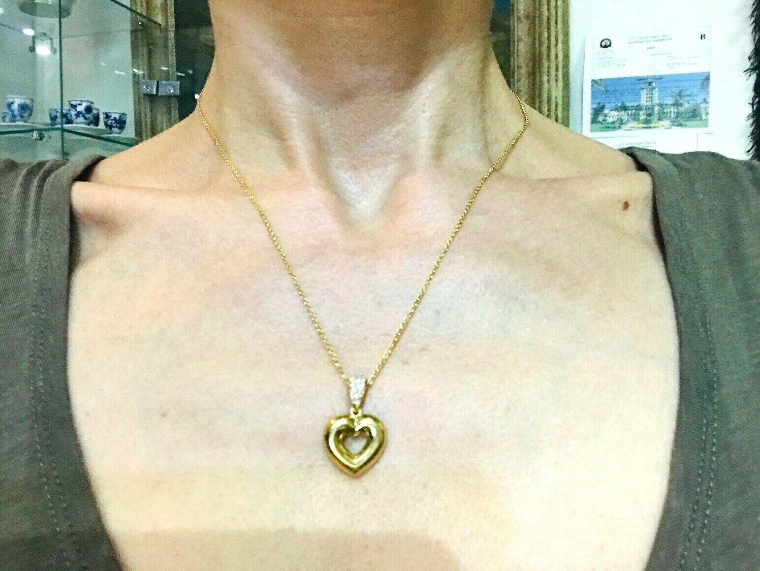 Vintage Chaumet Paris 18k yellow gold and diamond Heart pendant features 18k chain necklace.
Diamond carat weight is about 0.9 pts.
Stamped with Chaumet Paris maker's mark, a hallmark for 18k gold and a serial number.
Measurements: chain is 1/16