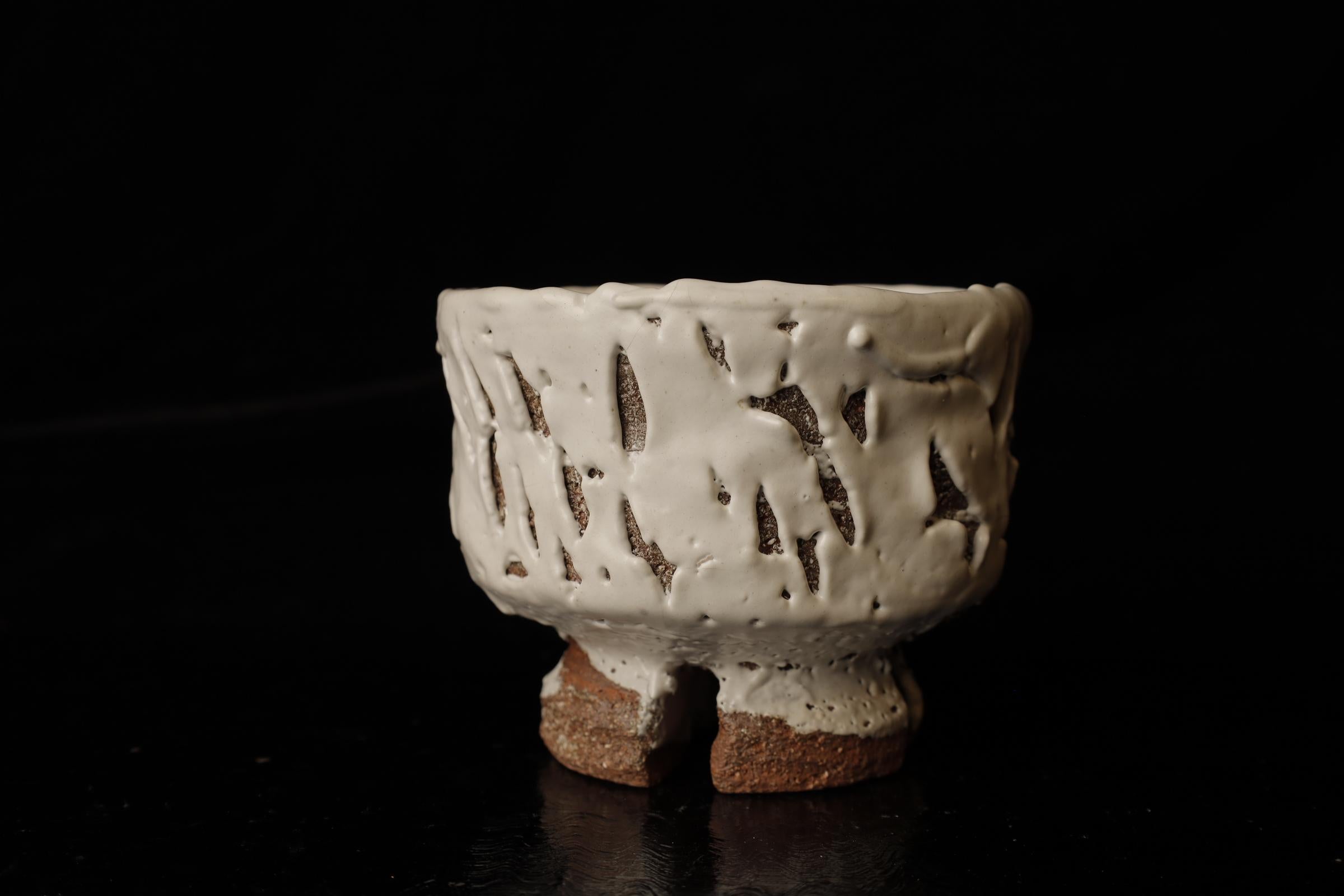 Oni Snow Bowl by Seigan Yamane, Hagi Ware

This exquisite Japanese tea bowl is a prime example of Hagi Ware, crafted by renowned potter Seigan Yamane. Known for his innovative approach to traditional Hagi pottery, Yamane’s work is celebrated for its