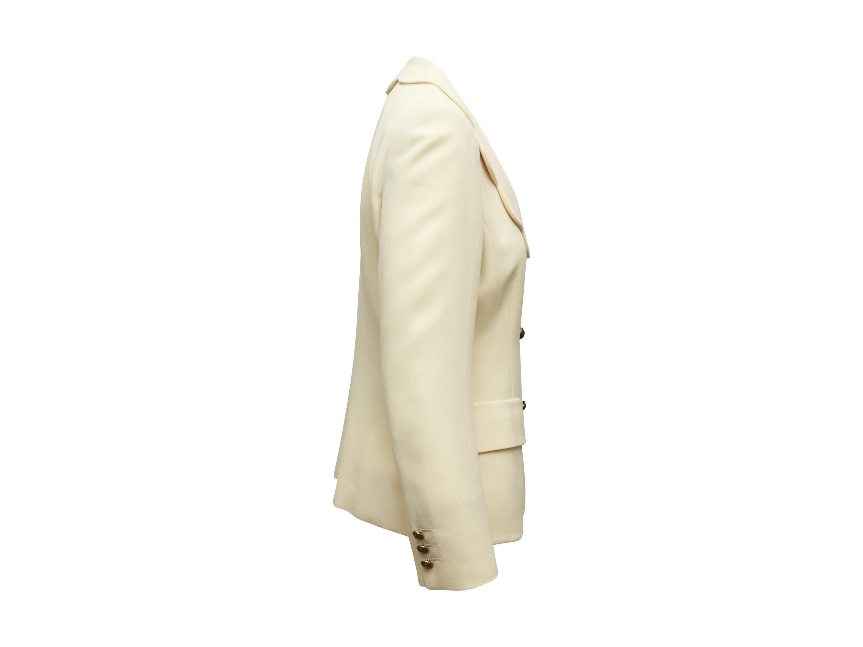 Product details:  Vintage cream scalloped jacket by Cheap and Chic by Moschino.  Scalloped lapel.  Long sleeves.  Three-button detail at cuffs.  Button-front closure.  Waist flap pockets.  28