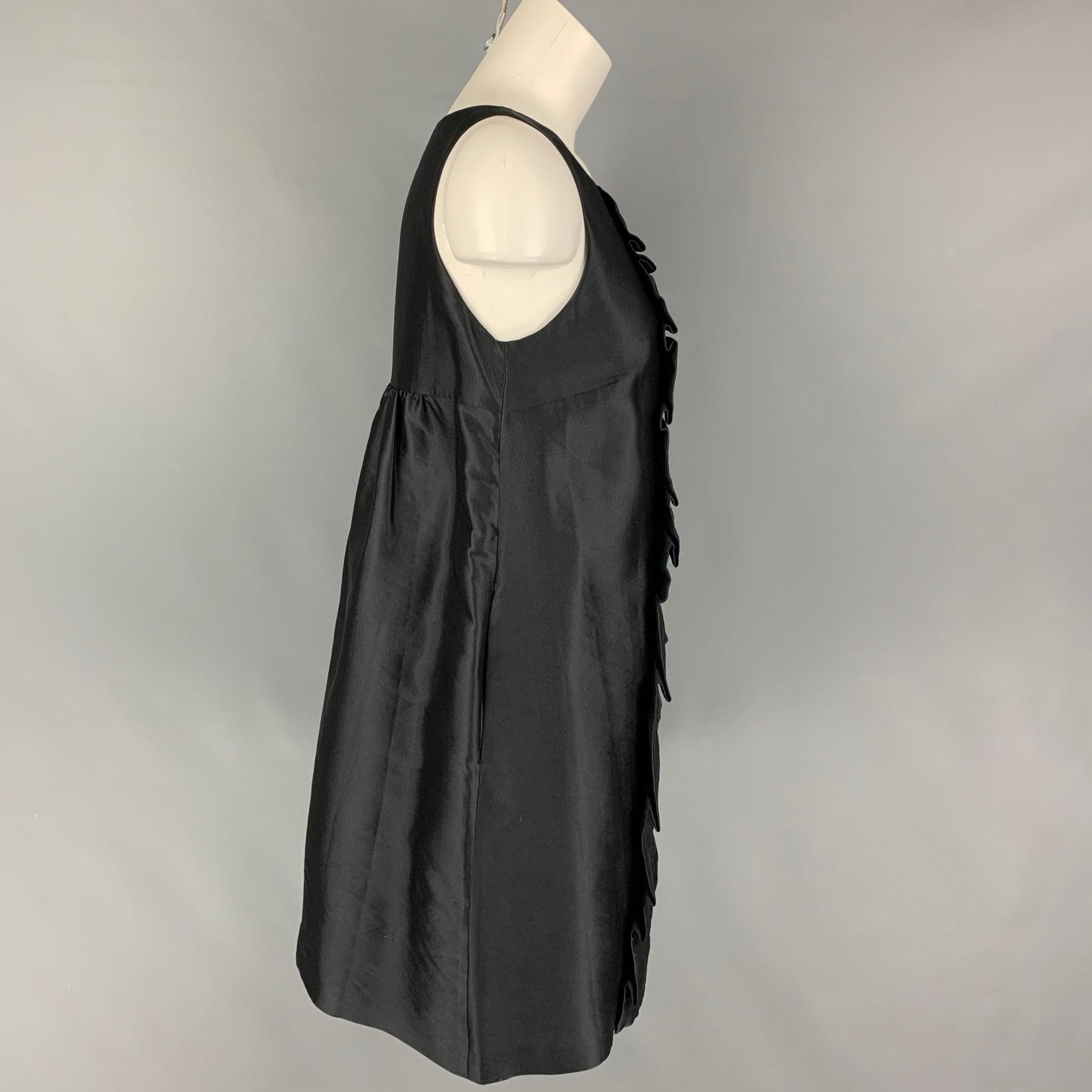 CHEAP and CHIC by MOSCHINO dress comes in a black silk / polyester featuring a front ruffled design, slit pockets, sleeveless, and a side zipper closure. Made in Italy.
Very Good
Pre-Owned Condition. 

Marked:   I 42 / D 38 / F 38 / GB 10 / USA 8