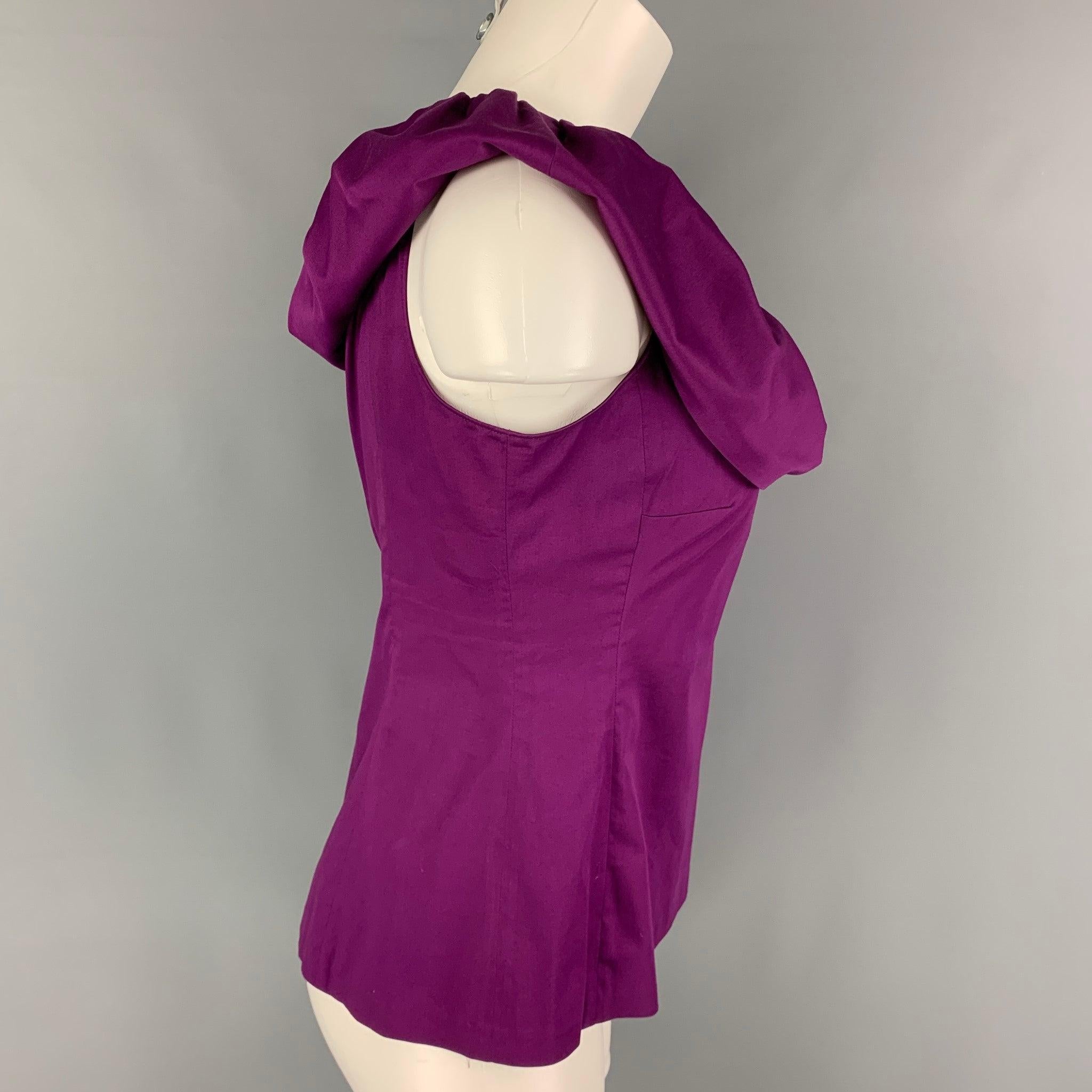 CHEAP and CHIC by MOSCHINO top comes in a purple cotton blend featuring a sleeveless style, ruffled detail, and a side zipper closure.
Very Good
Pre-Owned Condition. 

Marked:   I 42 / D 38 / F 38 / GB 10 / USA 8  

Measurements: 
  Bust: 36 inches