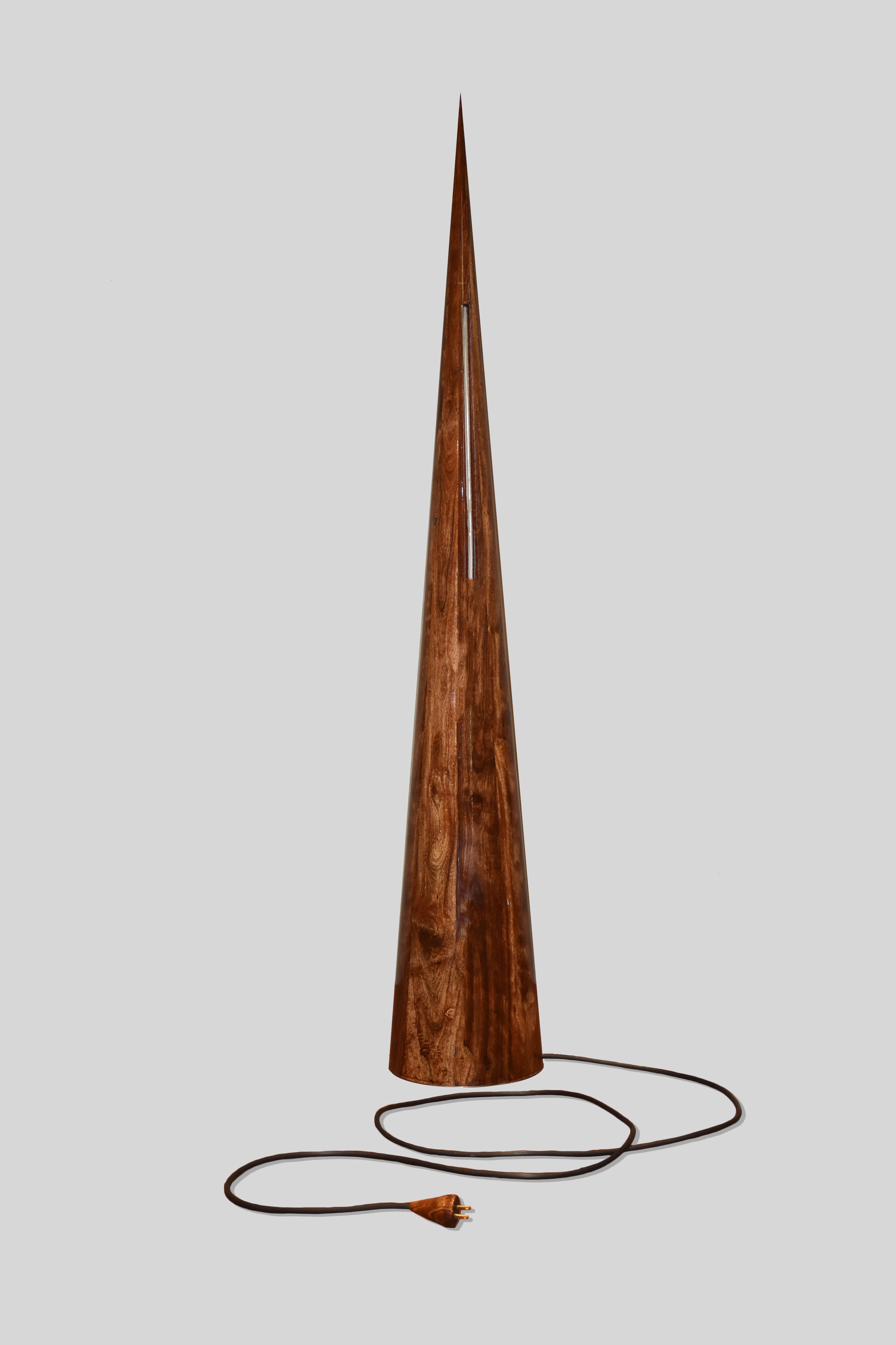 Chechen wood floor lamp by Alina Rotzinger.
Dimensions: H 25 x W 25 x D 155 cm.
Materials: Certified Chechen tropical wood, aluminum details.

Composed by Alina Rotzinger as design director and artist and Sebastian Rotzinger as industrial