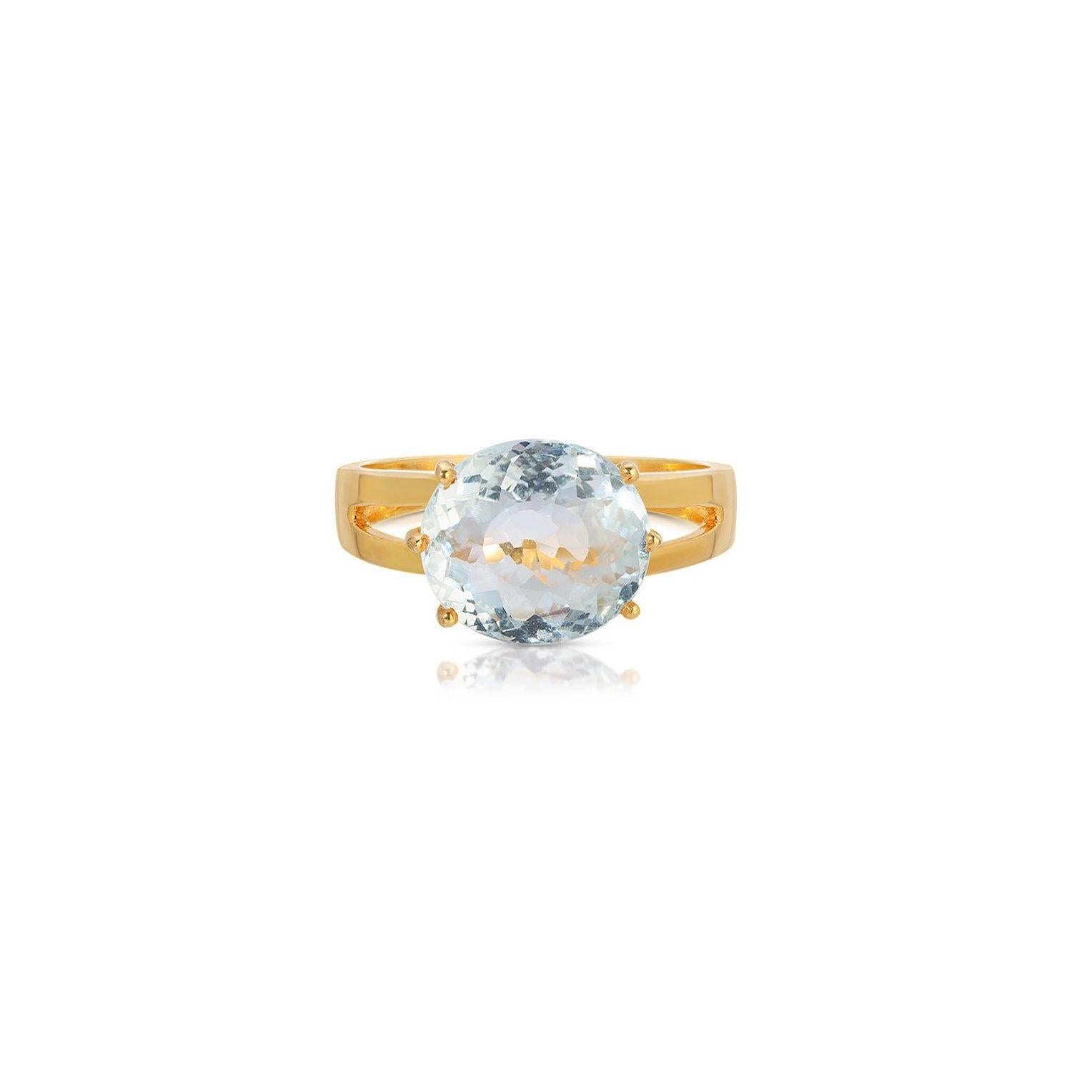 A gorgeous dress ring of modern design.  This ring features a beautiful 6.20 Carats ocean colored Aquamarine with a checker cut of exceptional luminosity.  This stylish dress ring is set in 22 Karat Gold overlay Silver.