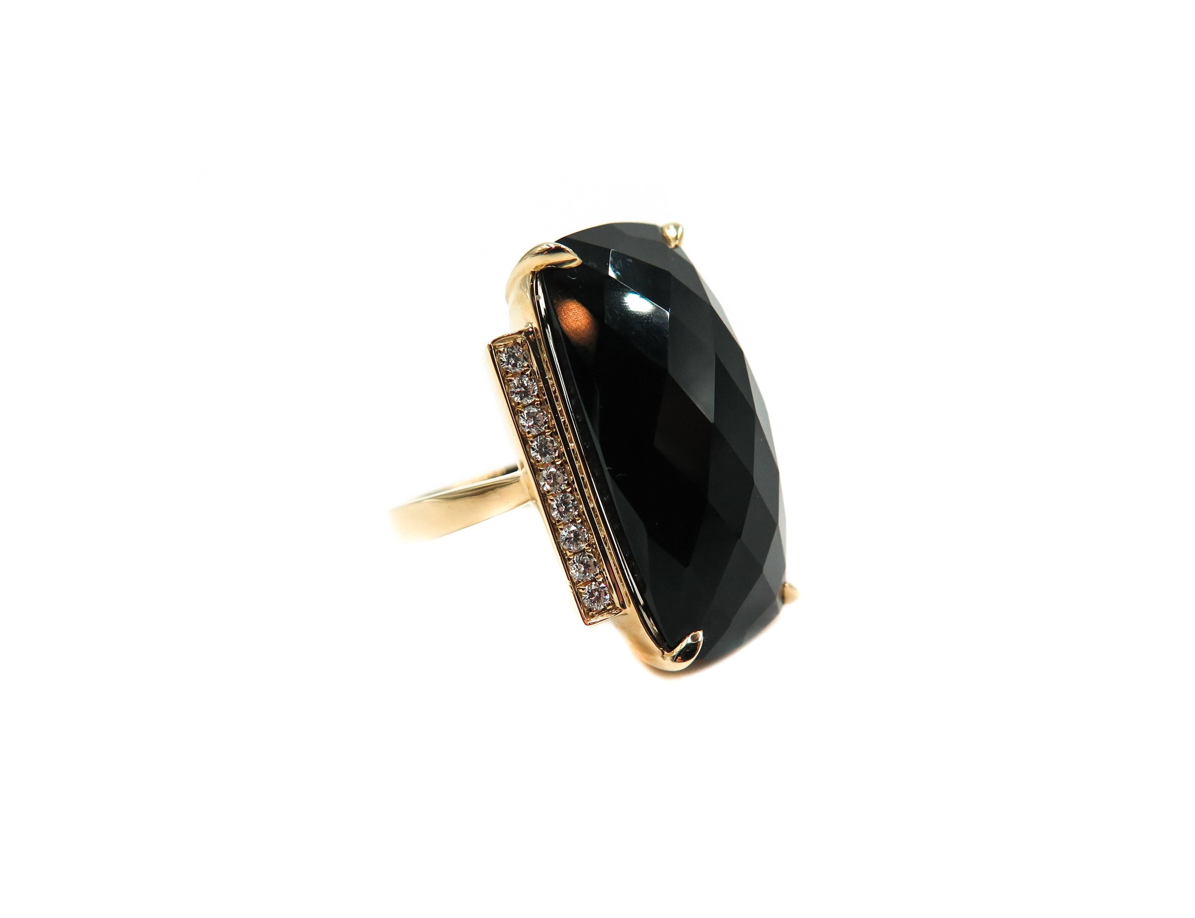 A piece of jewelry that begins with a pencil and a sketch board. This ring is designed combining 18 karat yellow gold, diamonds and checker cut black onyx to create this unique piece. 
The attention to detail to produce this dramatic creation, sets