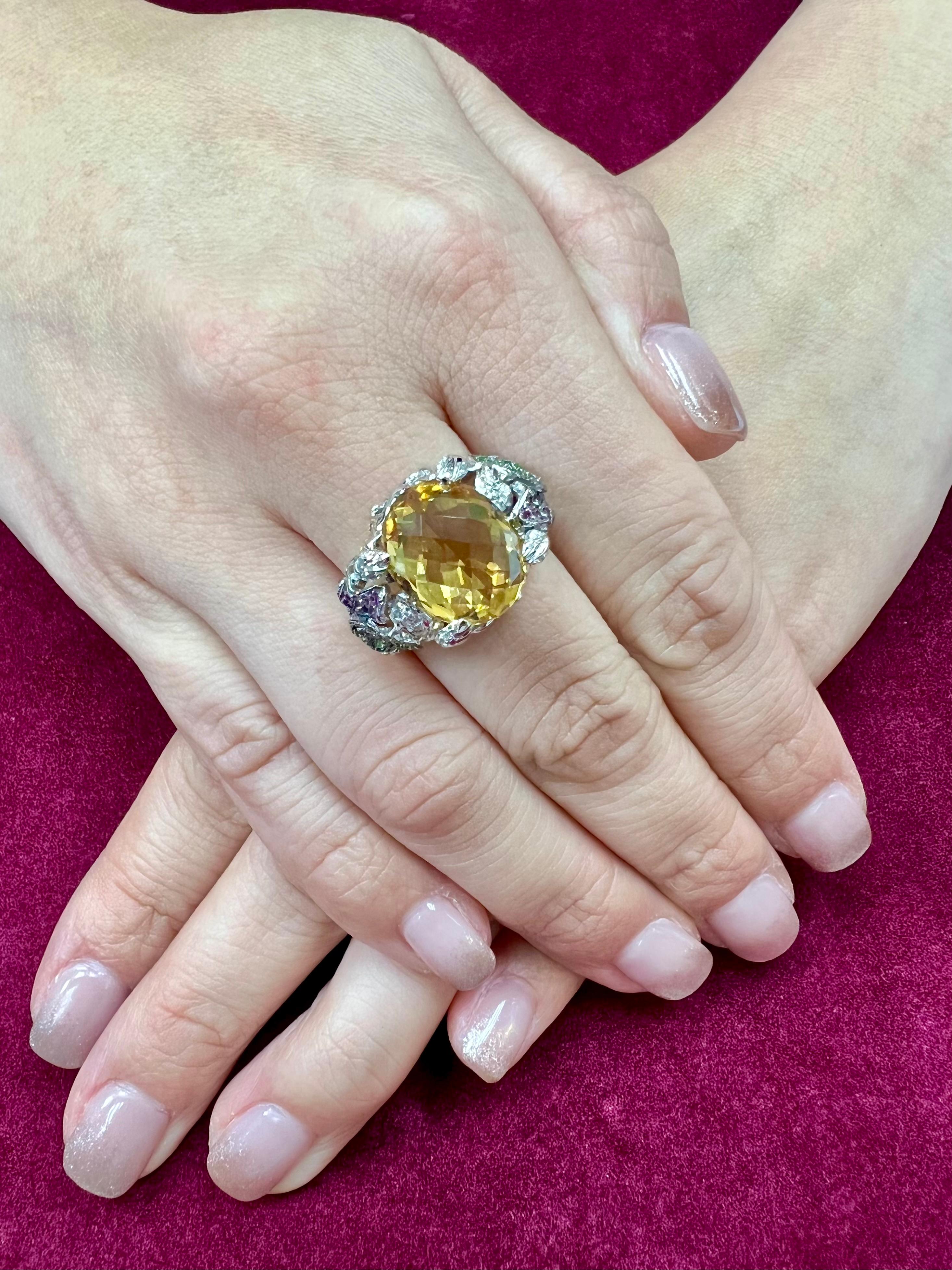 Please check out the HD video! Here is a super nice checker cut yellow Topaz, diamond and colored gemstone cocktail statement ring. It is set in 18k white gold. The 7.12 cts center checker cut Topaz is well cut. The colored gemstones (0.75cts) in